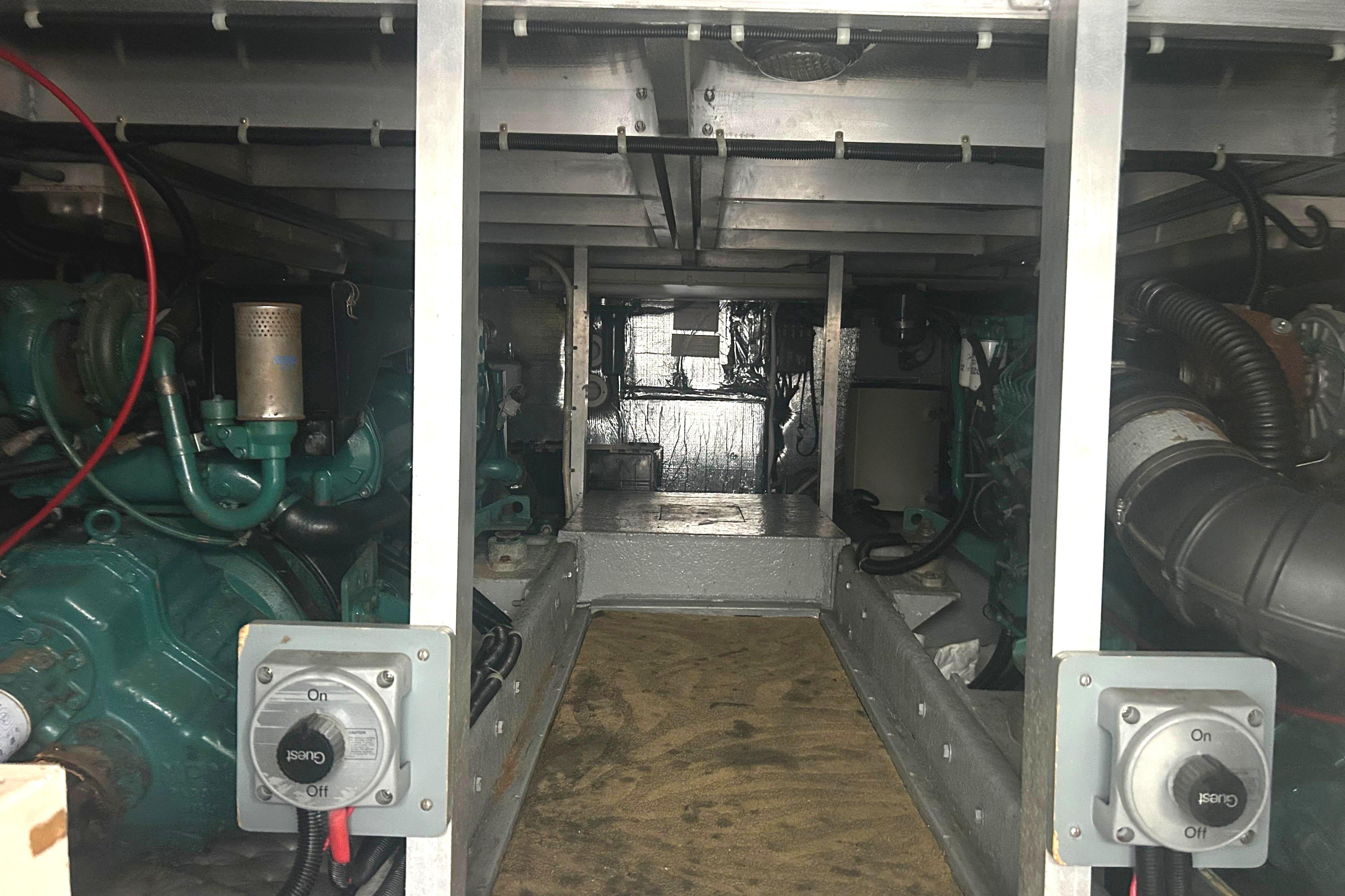 Engine room of a 1996 Navigator 53 Classic yacht, showcasing mechanical components.