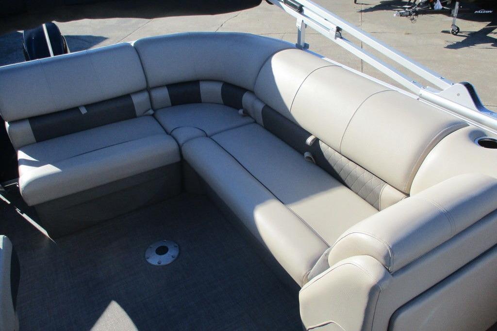 2022 Sun Tracker Party Barge 20 DLX interior with plush seating and cup holder.
