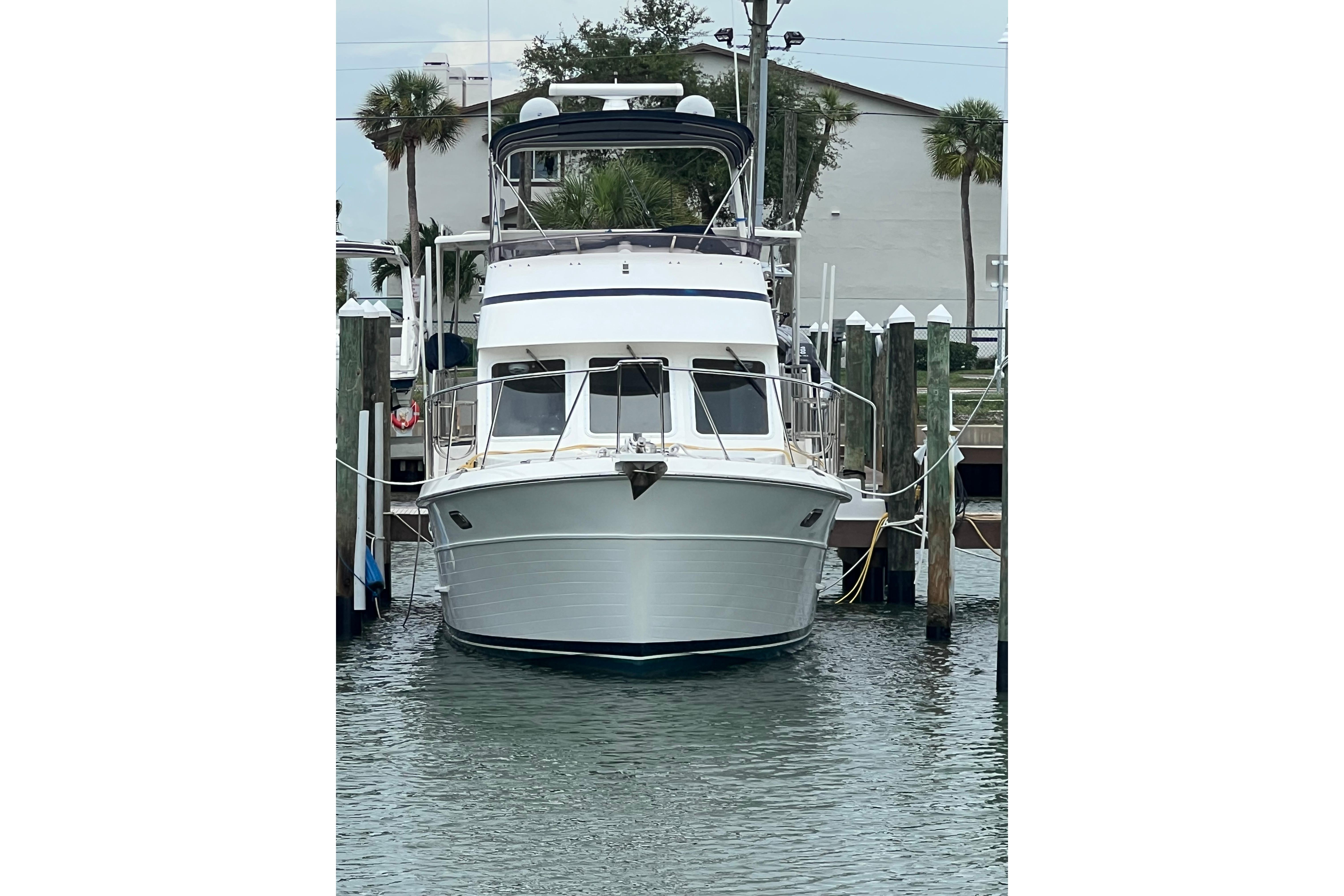 2007 Heritage East 36 Sundeck Trawler docked at marina, front view.