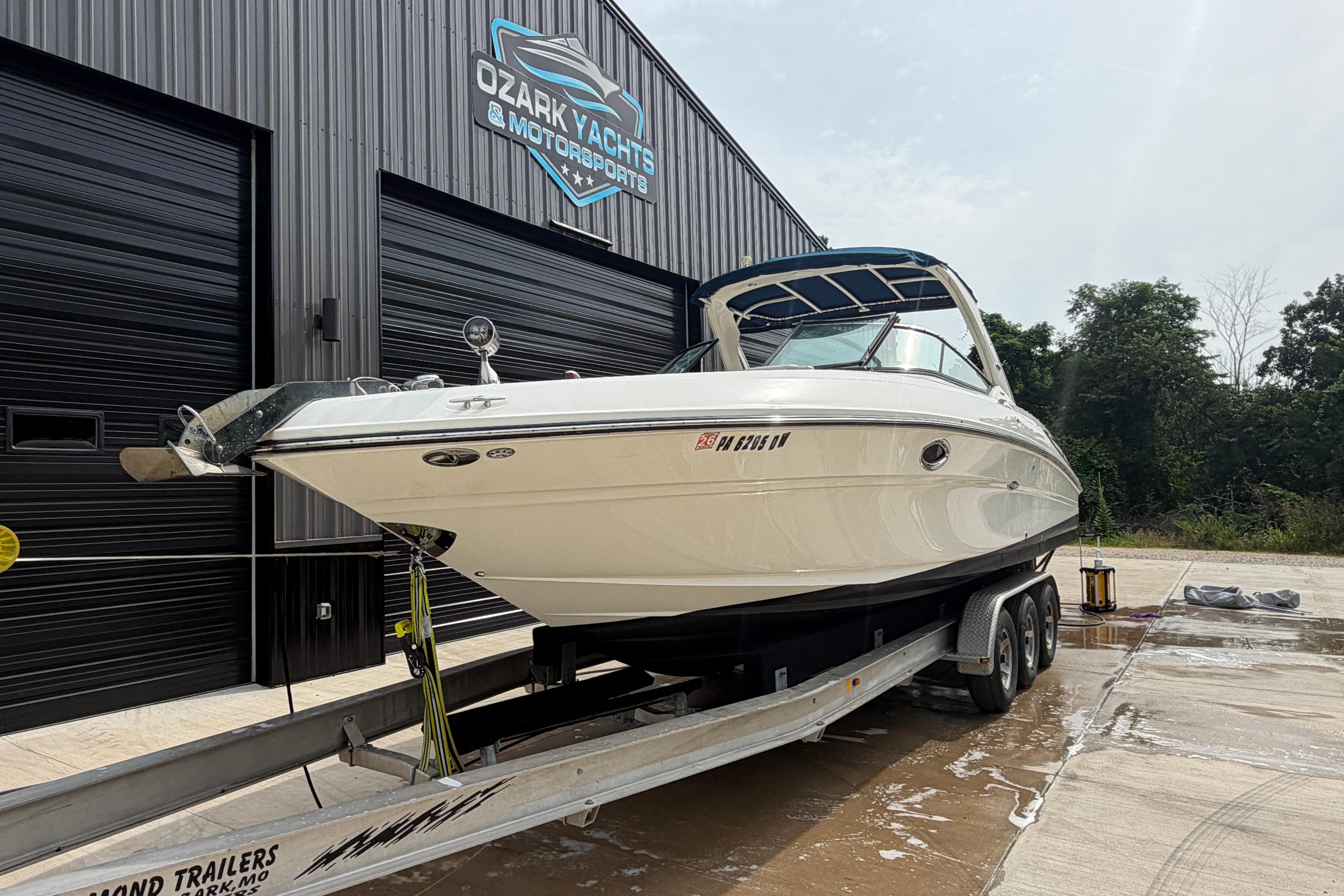 2013 Sea Ray 300 SLX boat on trailer at Ozark Yachts facility.