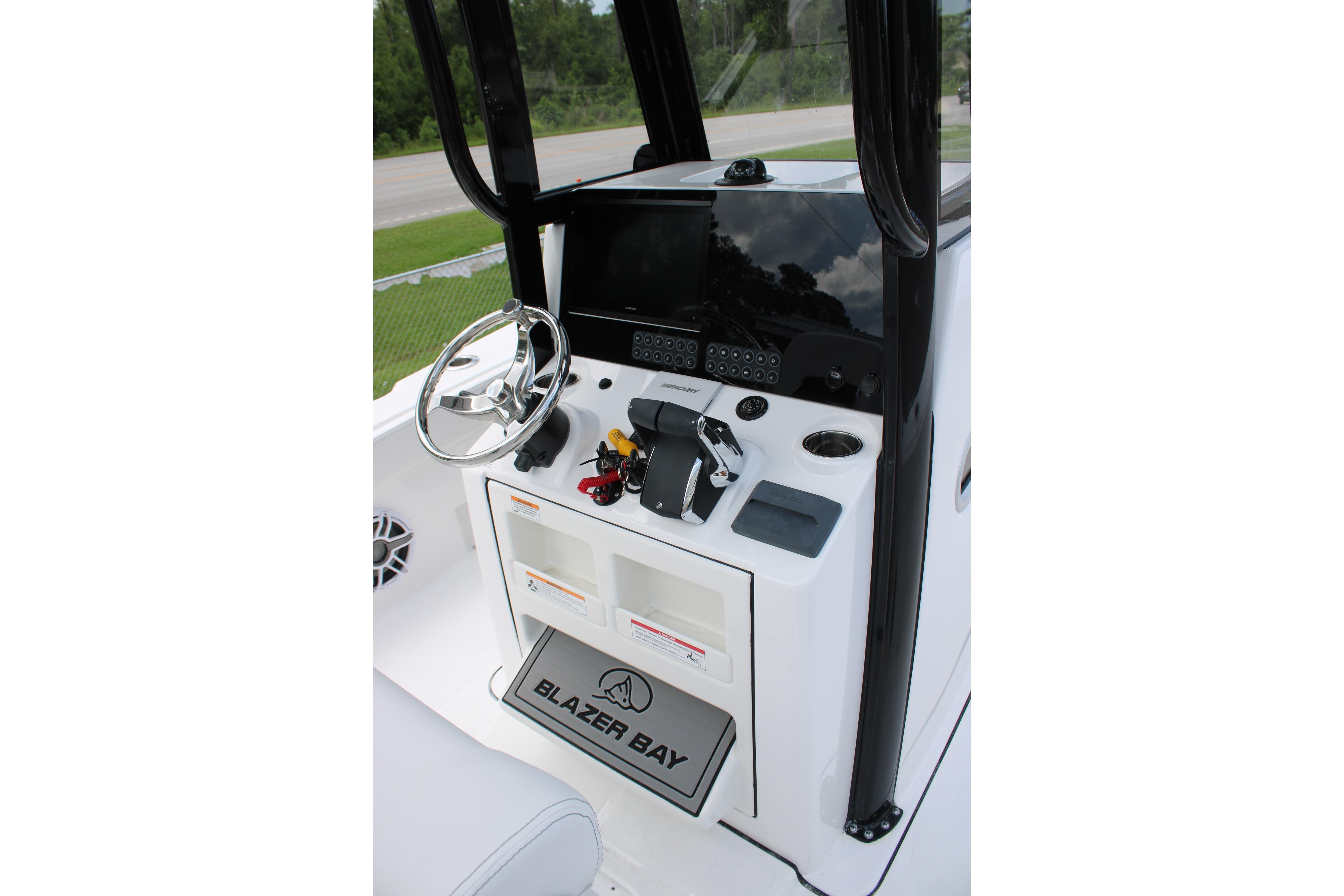 2027 Blazer Bay Makaira 2800 boat console with steering wheel and controls.