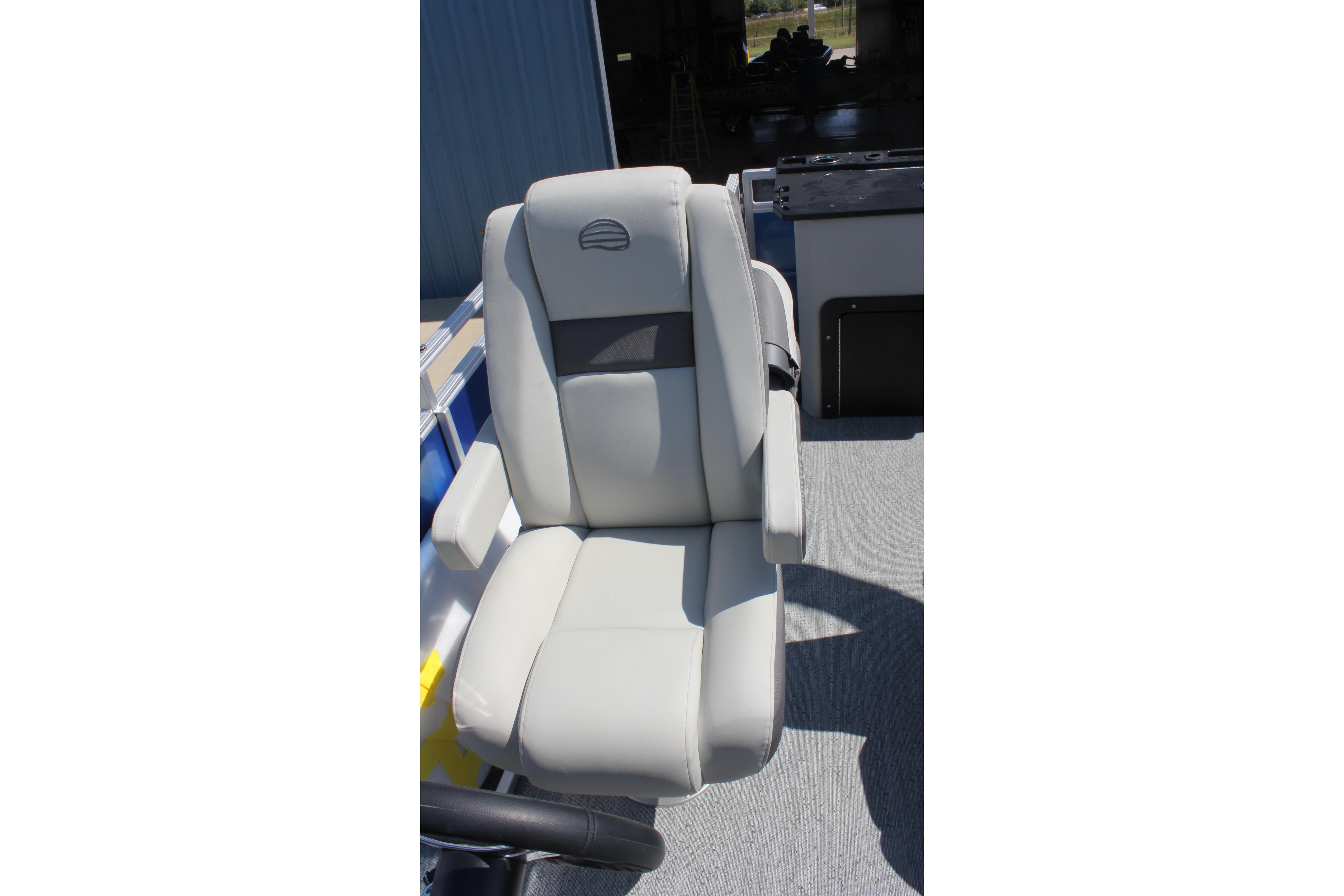 2026 Sun Tracker Fishin' Barge 20 DLX boat seat, featuring comfortable gray upholstery.