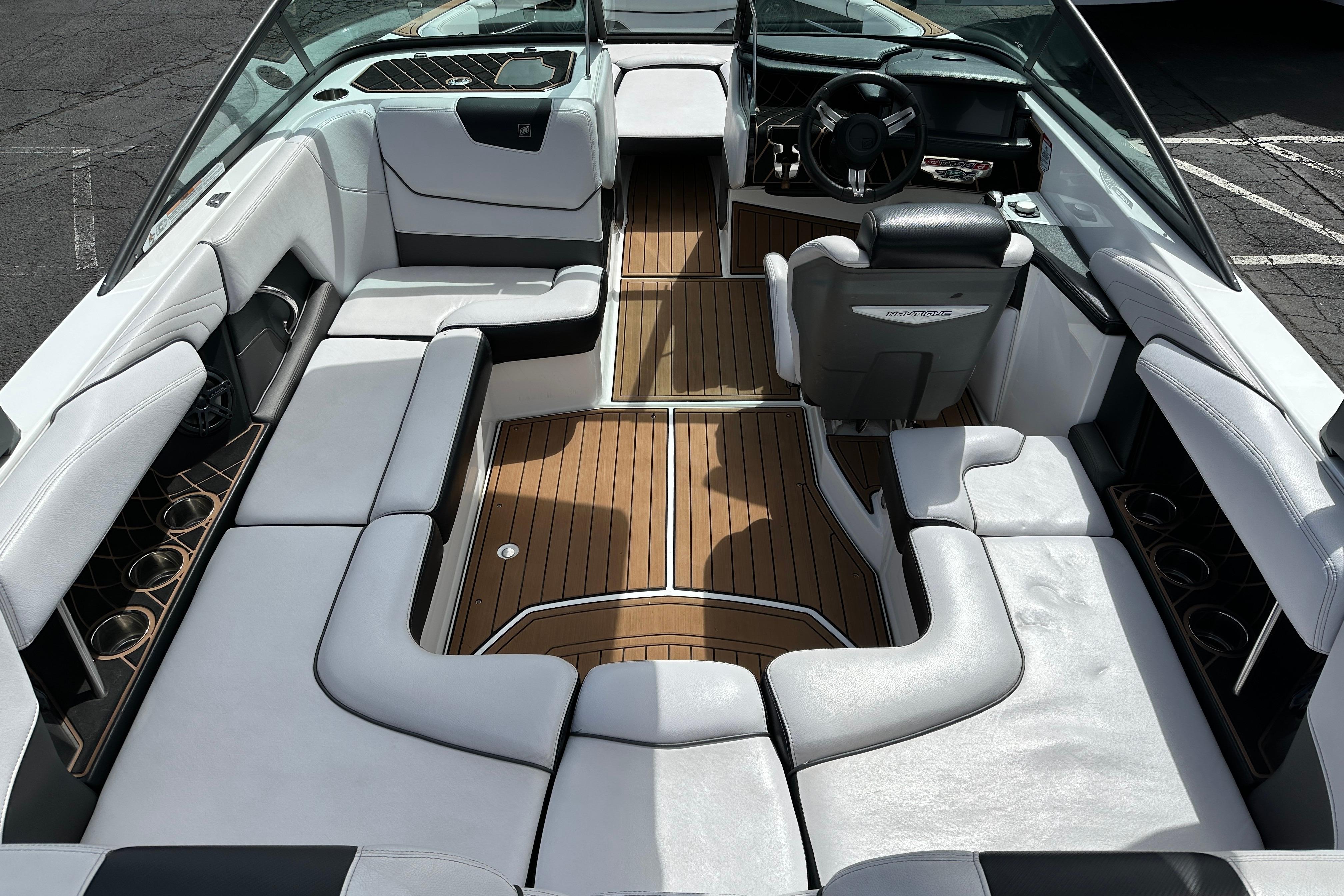 2017 Nautique Super Air Nautique GS20 interior with white seating and wood accents.