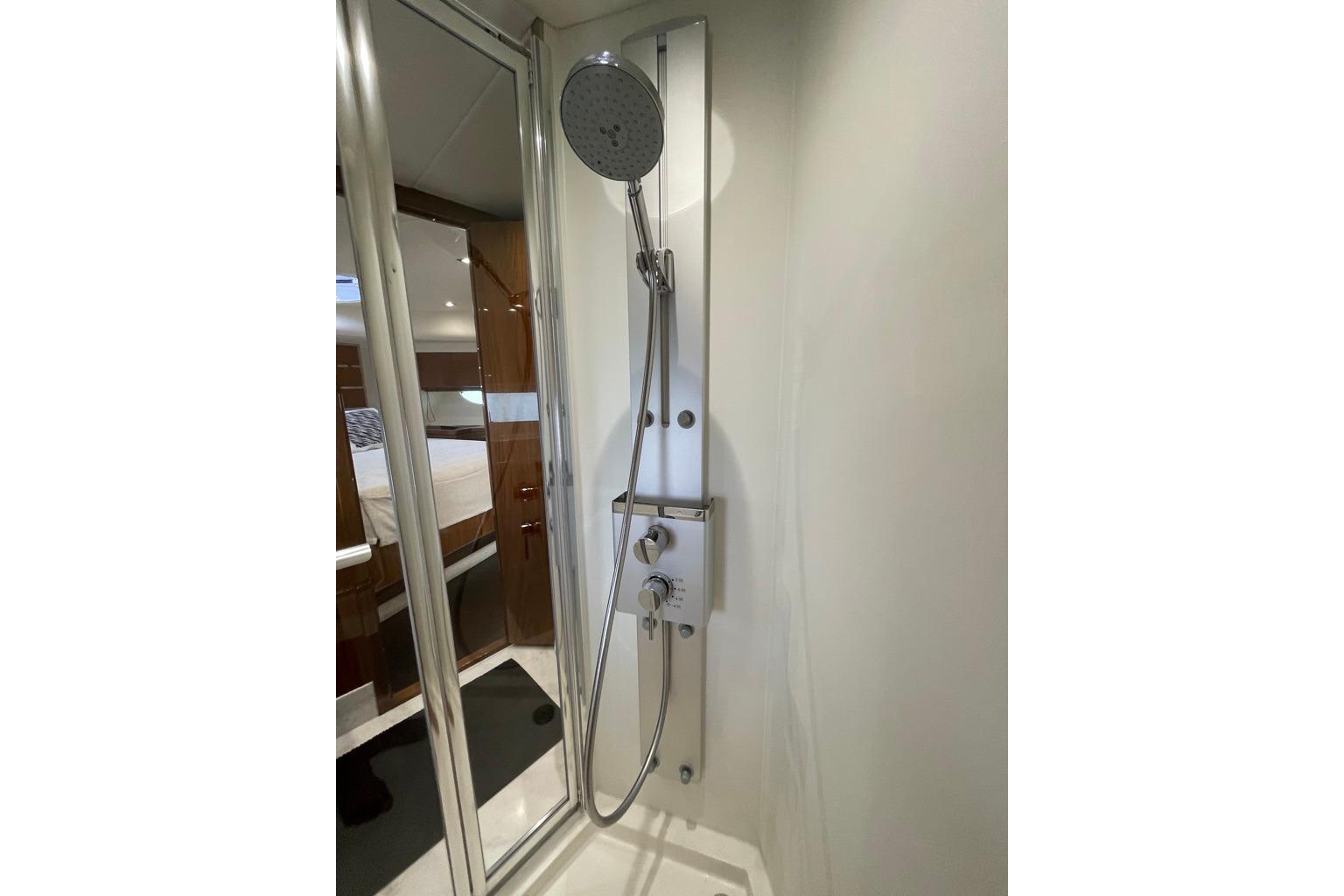 Shower area in 2016 Sunseeker Manhattan 65 yacht, featuring modern fixtures and sleek design.