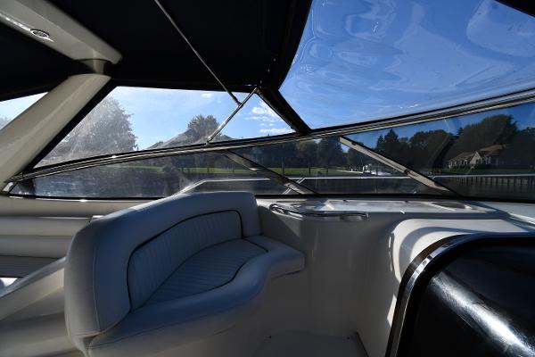 Interior view of 1997 Sunseeker Camargue 47 yacht with sleek seating and panoramic windows.