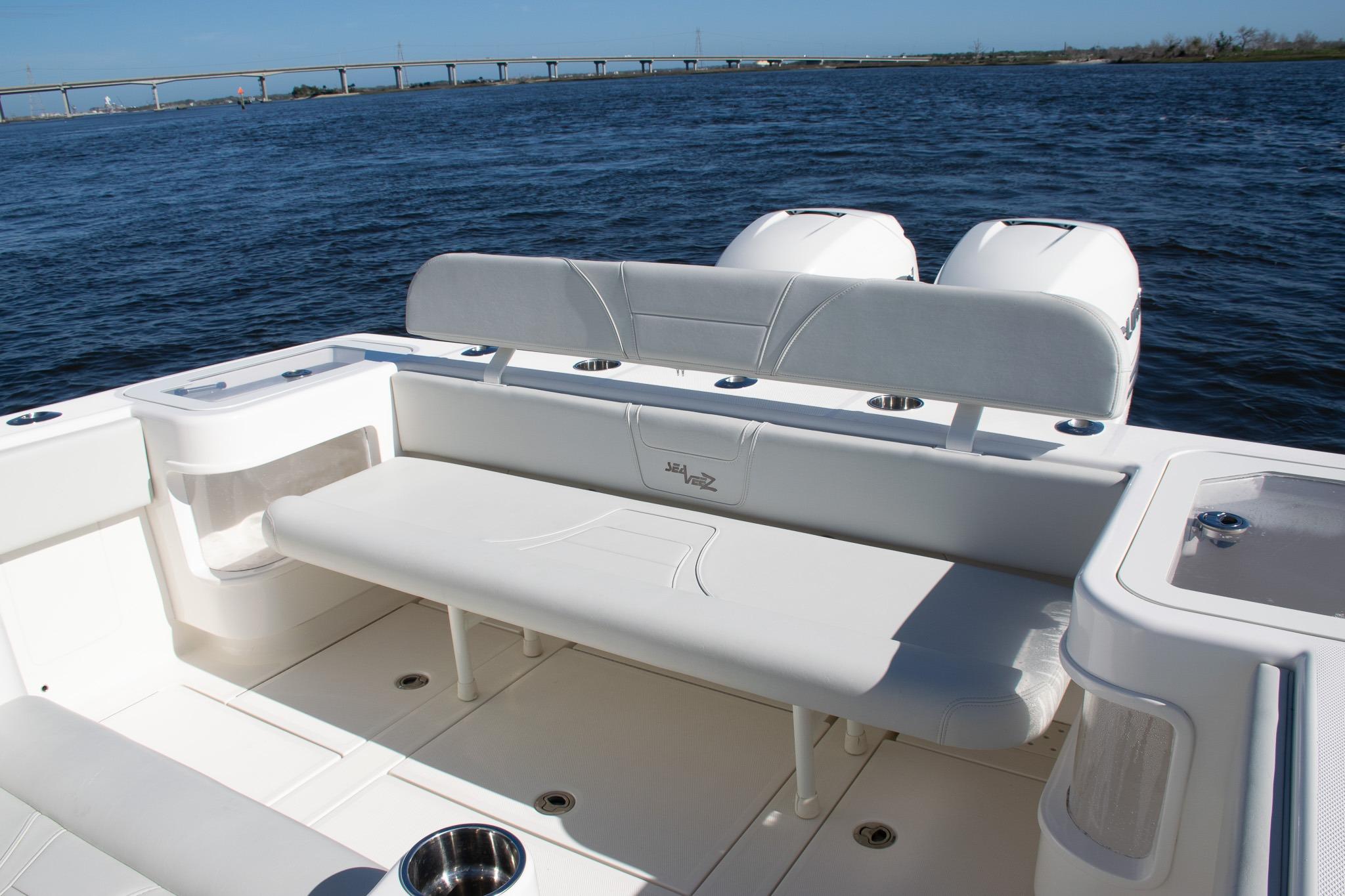 2022 SeaVee 322Z boat interior with seating, ocean view, and bridge in background.