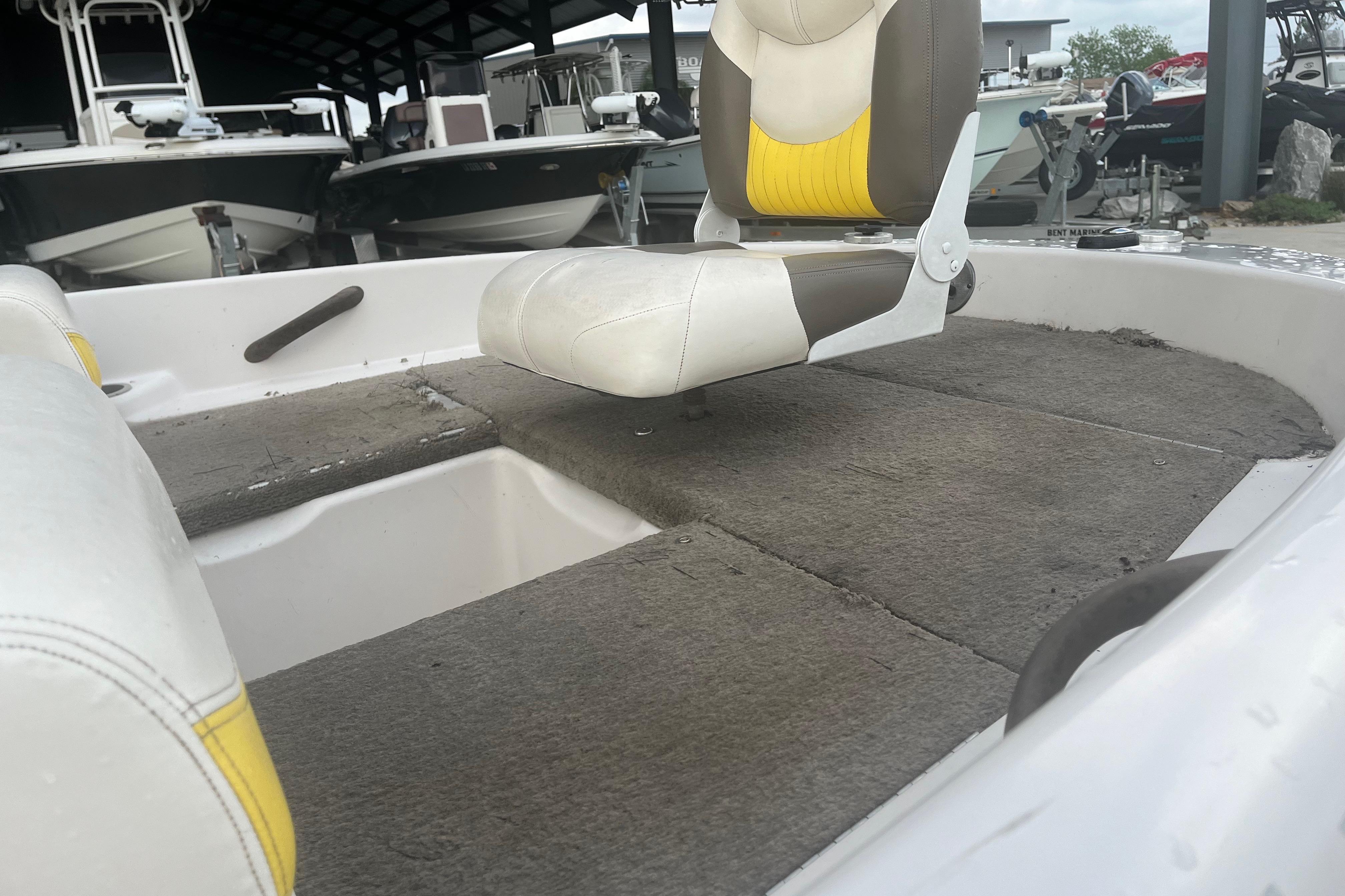 2006 Nitro 189 Sport boat interior with seating and carpeted deck.
