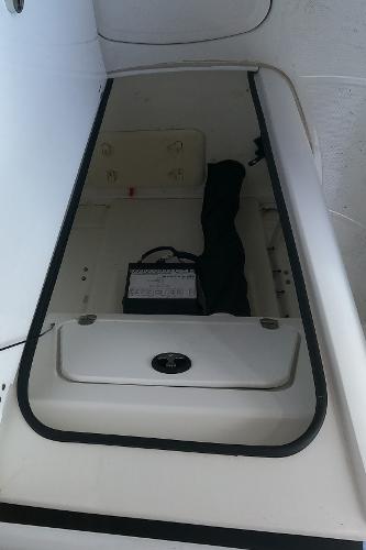 2023 Tahoe 2150 CC boat storage compartment with battery.