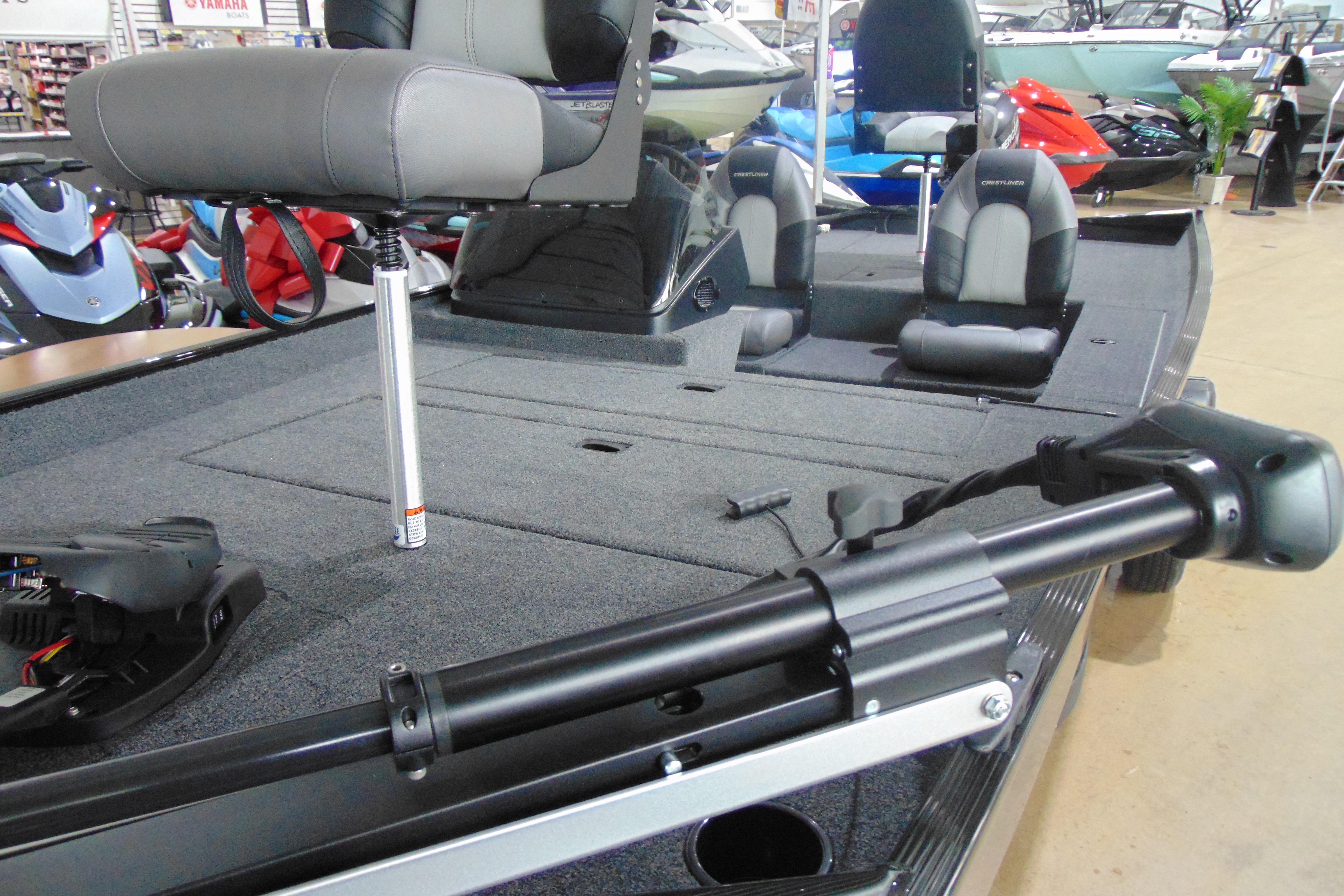 2026 Crestliner 1700 Storm boat interior with seating and equipment in showroom.