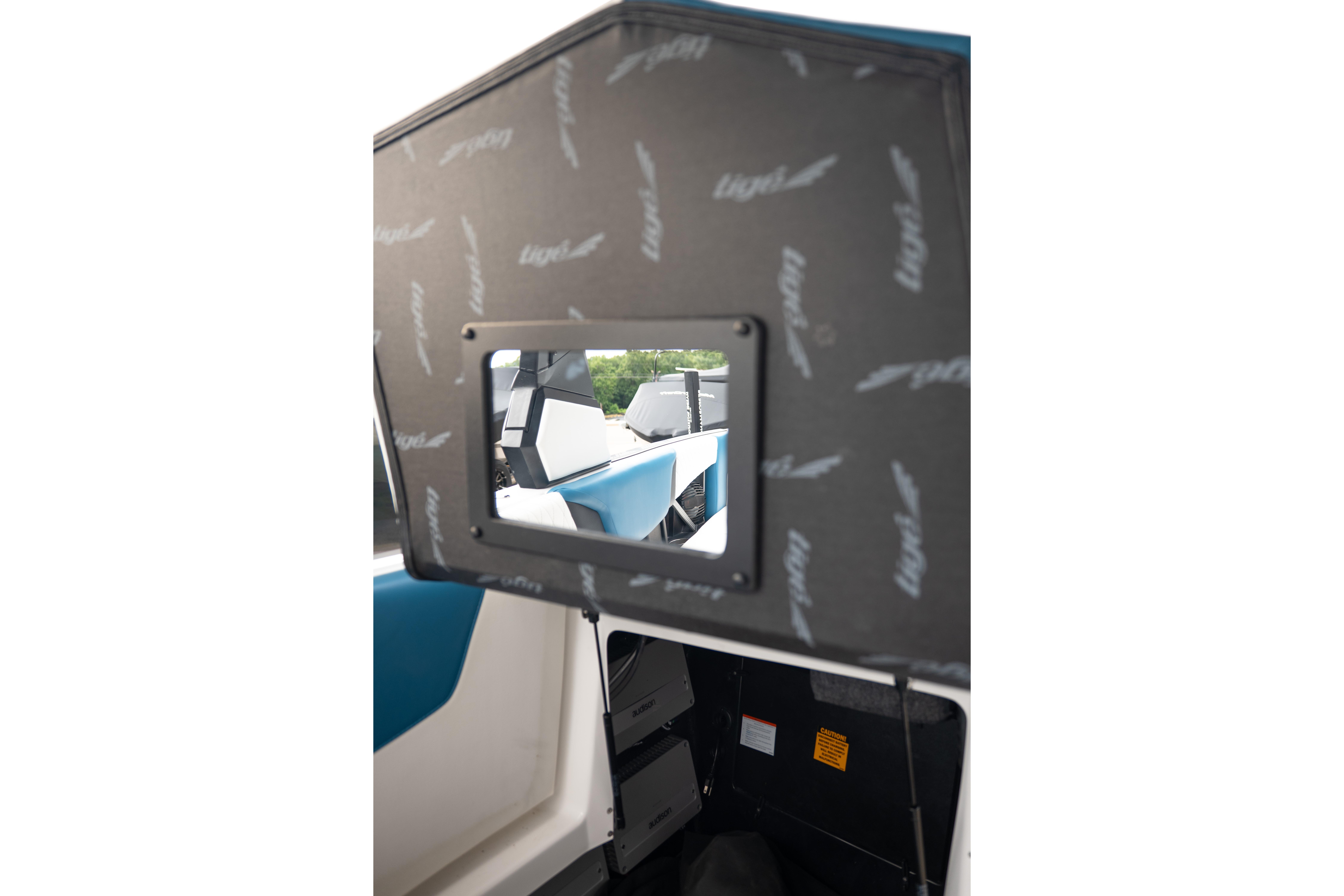 2024 Tigé Z5 boat interior with storage compartment and seating view.