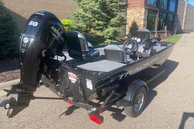 2026 Tracker Pro 170 boat with Mercury 50 engine, parked outdoors.