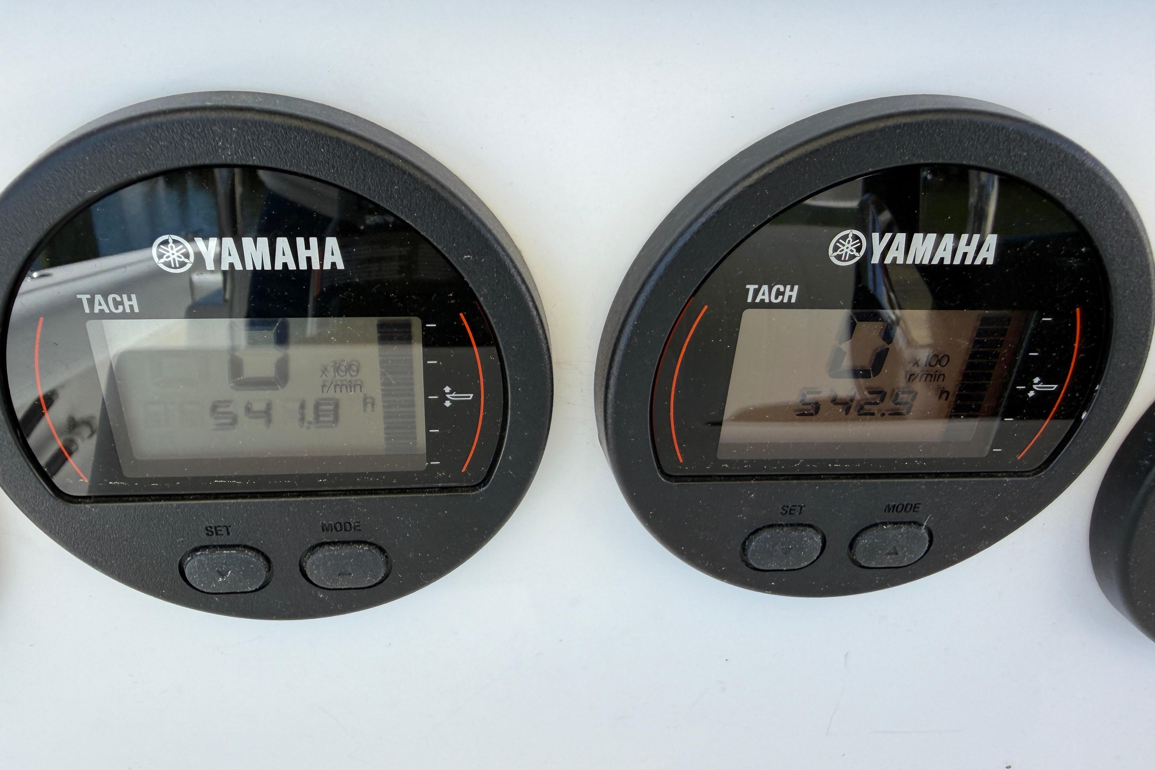 Yamaha tachometers on a 2006 Southport 26 Center Console boat dashboard.