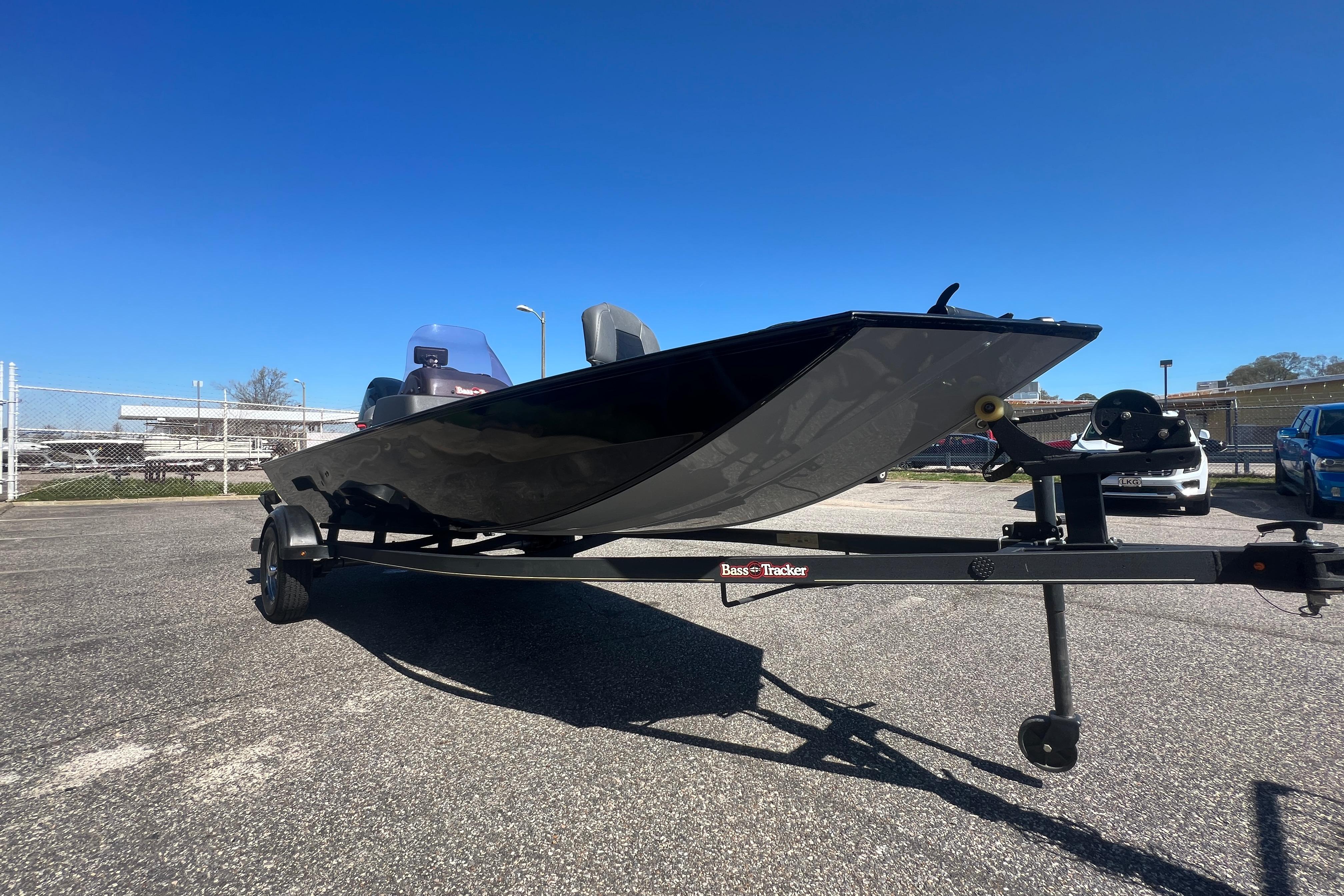 2023 Tracker Bass Tracker Classic XL boat on trailer under clear blue sky.