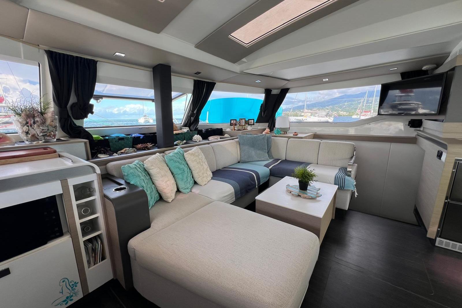 Luxurious interior of 2022 Fountaine Pajot Elba 45 Catamaran with modern seating and decor.