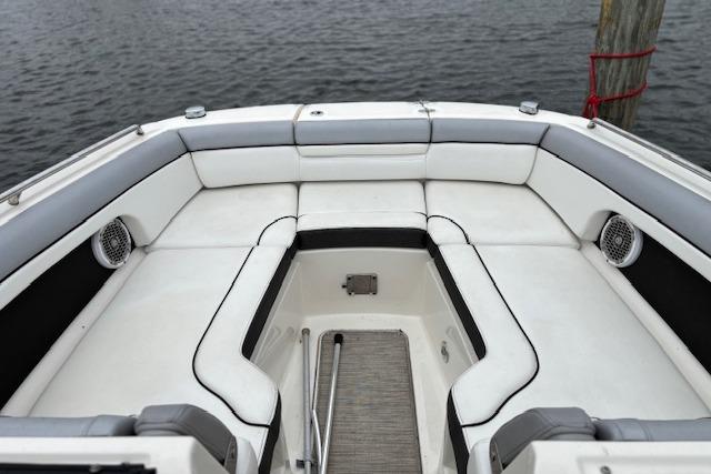 2016 Sea Ray 270 Sundeck boat interior with white seating and water view.