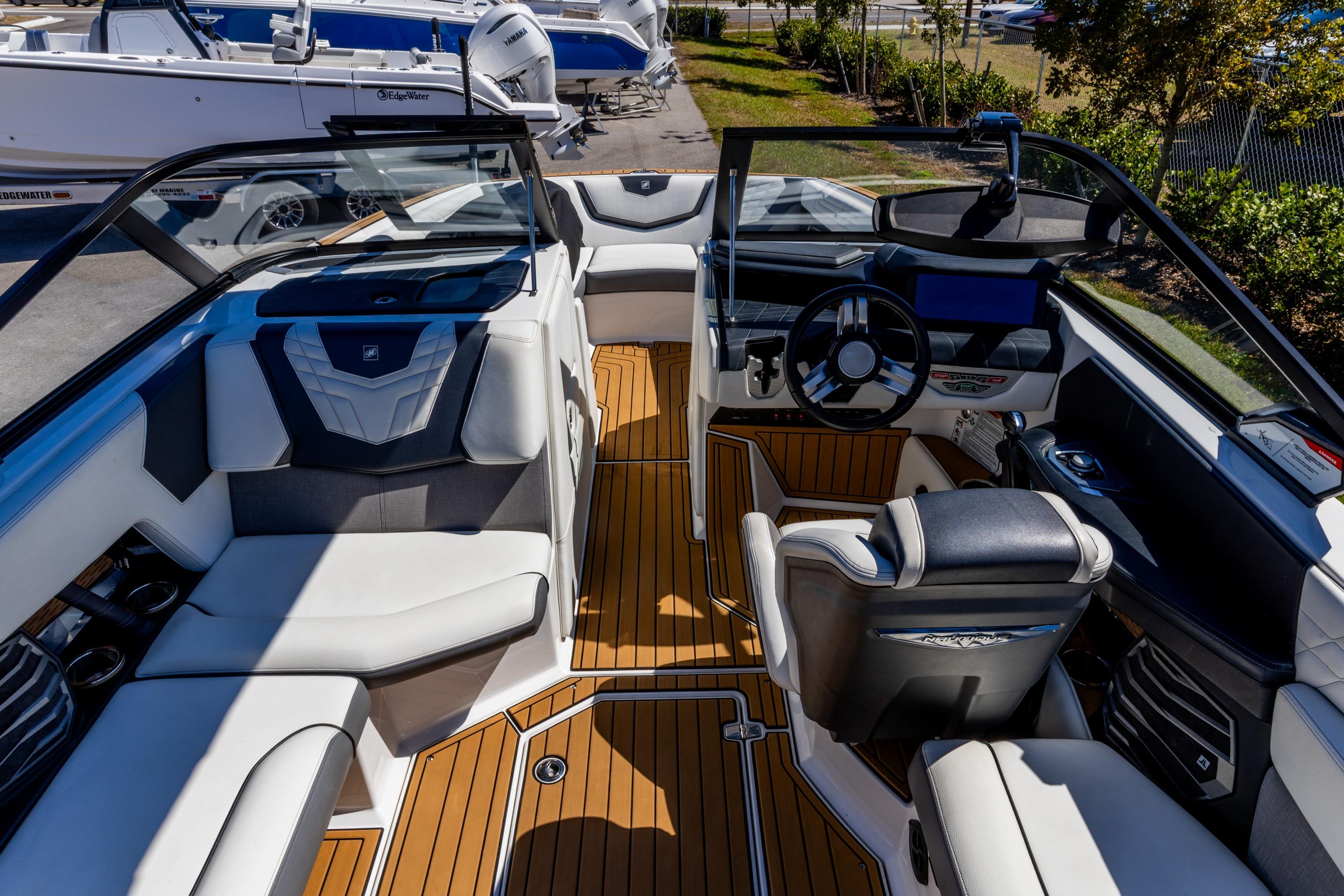 2022 Nautique Super Air Nautique G23 interior with luxurious seating and modern dashboard.