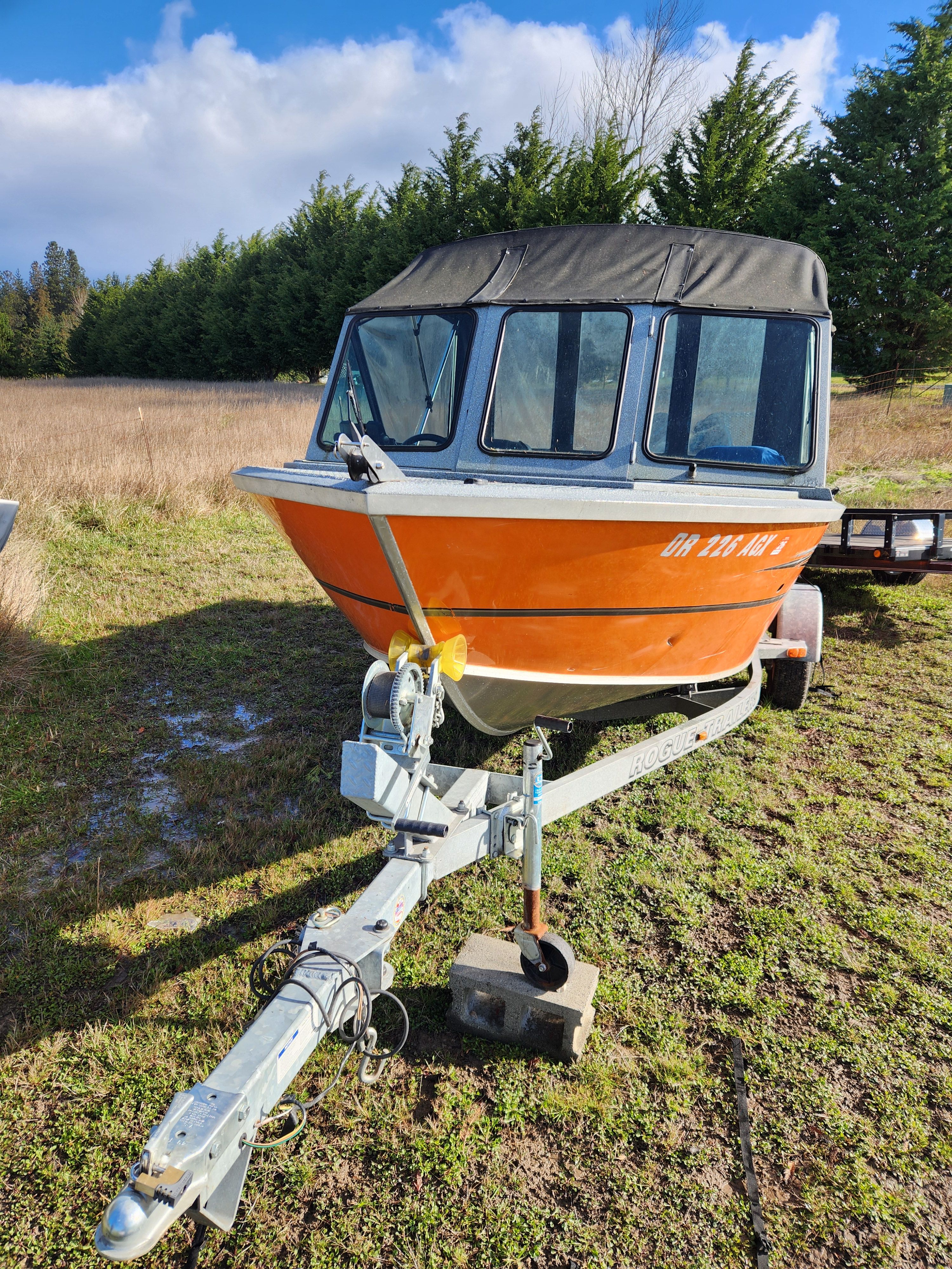 2020 Alumaweld Talon 18 boat on trailer outdoors.