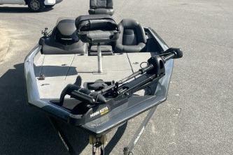 2019 Tracker Pro Team 190 TX fishing boat with trolling motor on pavement.