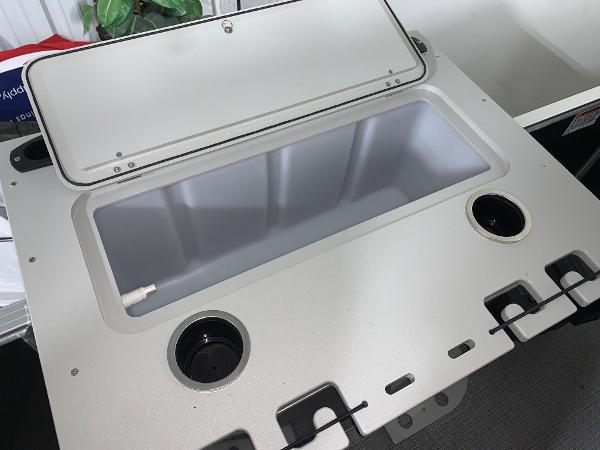 2024 Starcraft EX22 FD boat storage compartment with cup holders.