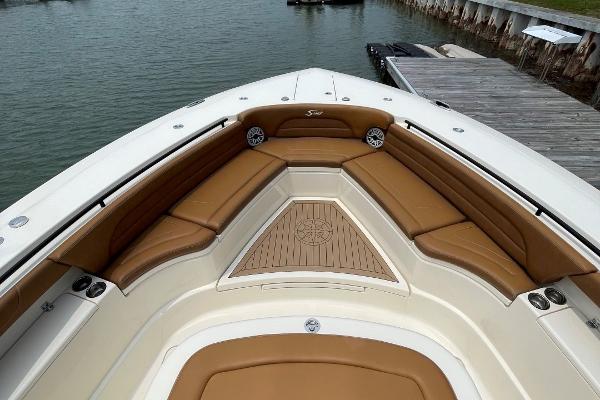2020 Scout 420 LXF boat interior with tan seating and wooden deck details.