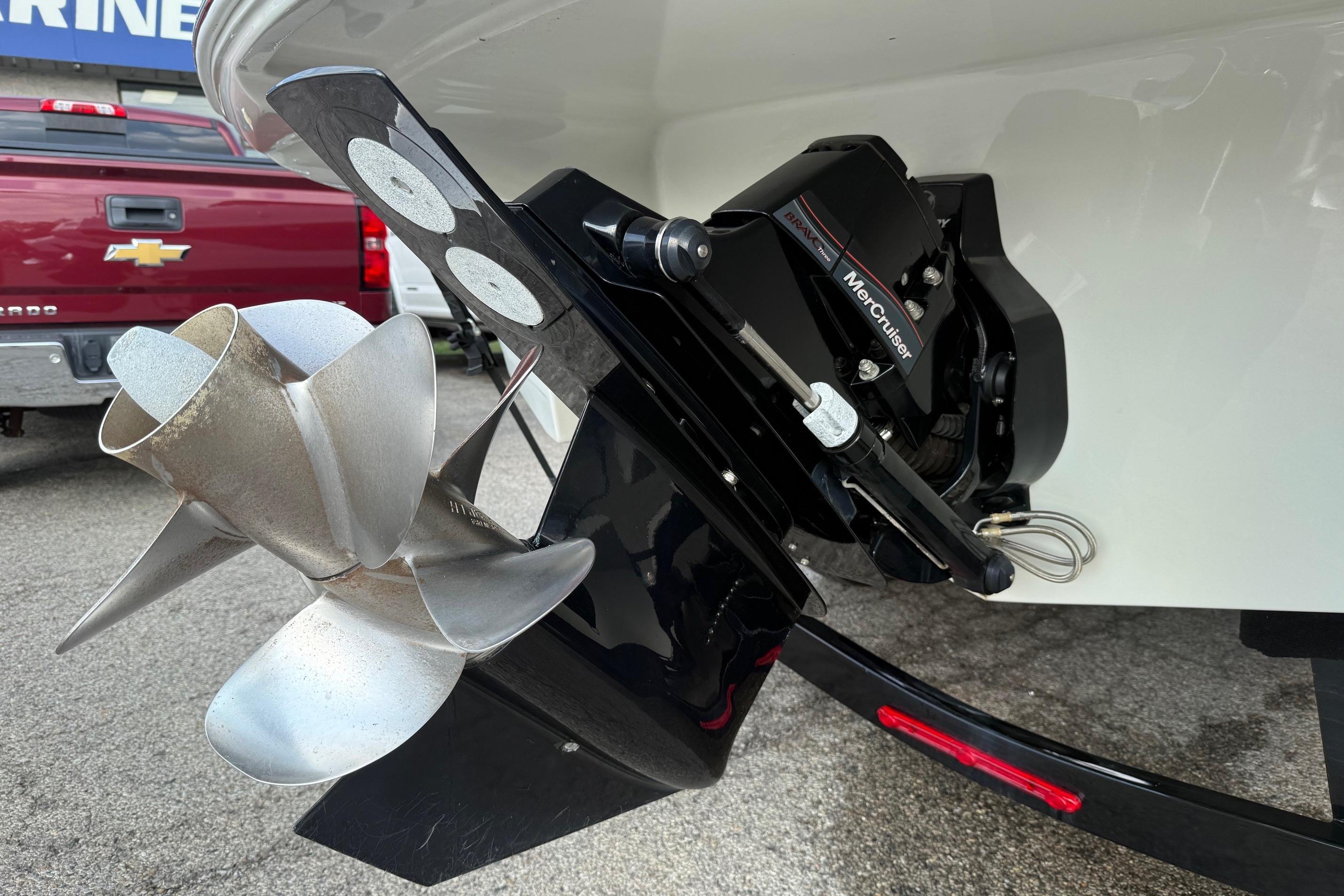 2023 Crownline 260 SS boat with MerCruiser engine and propeller detail.