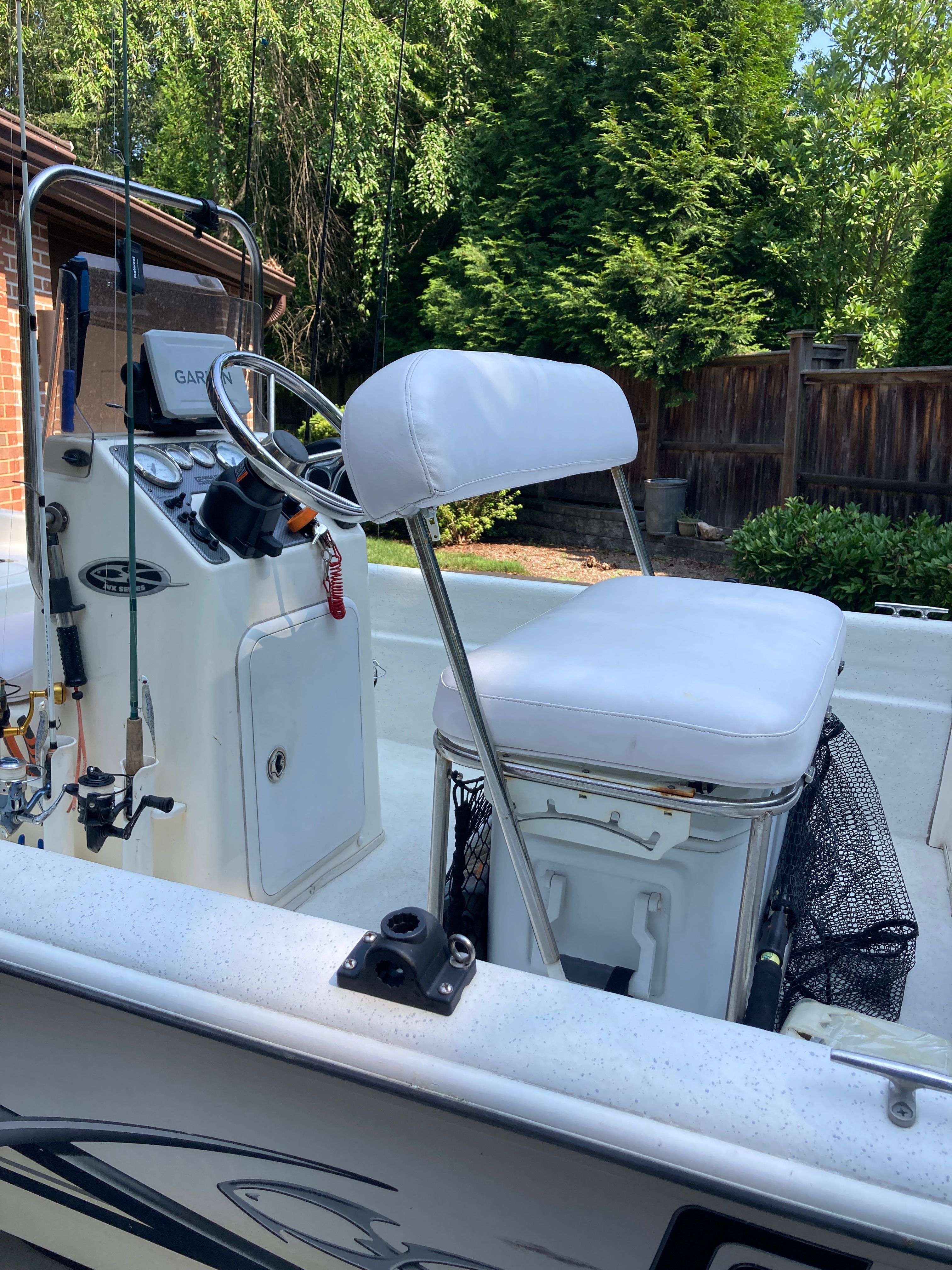 The image shows the cockpit of a 2012 Carolina Skiff JVX16CC with a white seat.