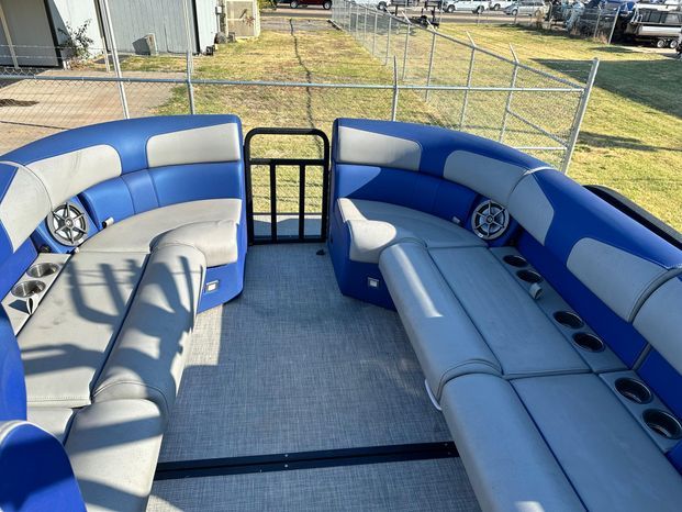 Interior of 2023 Montara 25' SURF BOSS 2.0 with blue and gray seating.