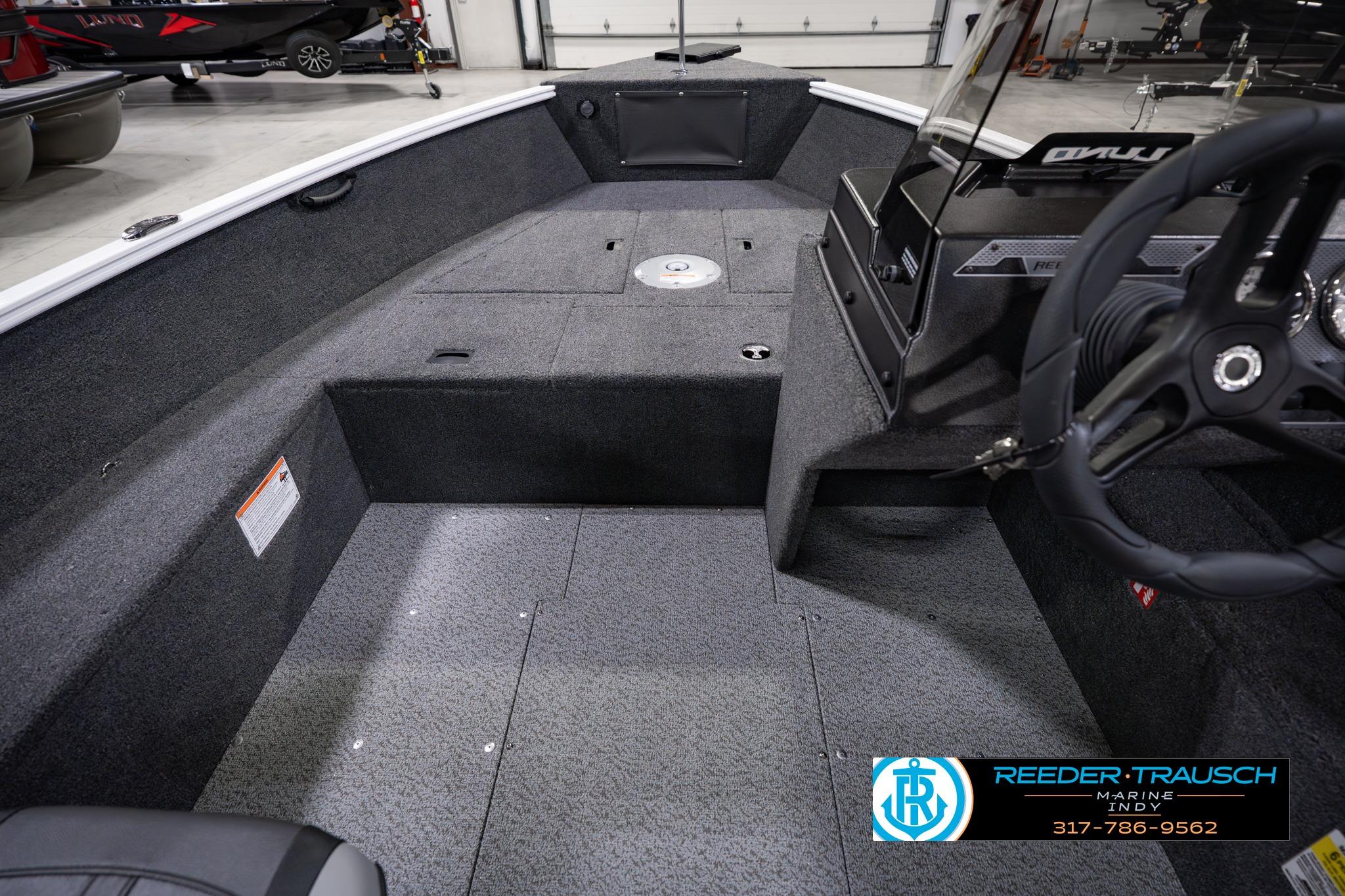 2026 Lund 1650 Rebel XL SS boat interior with steering wheel and storage compartments.