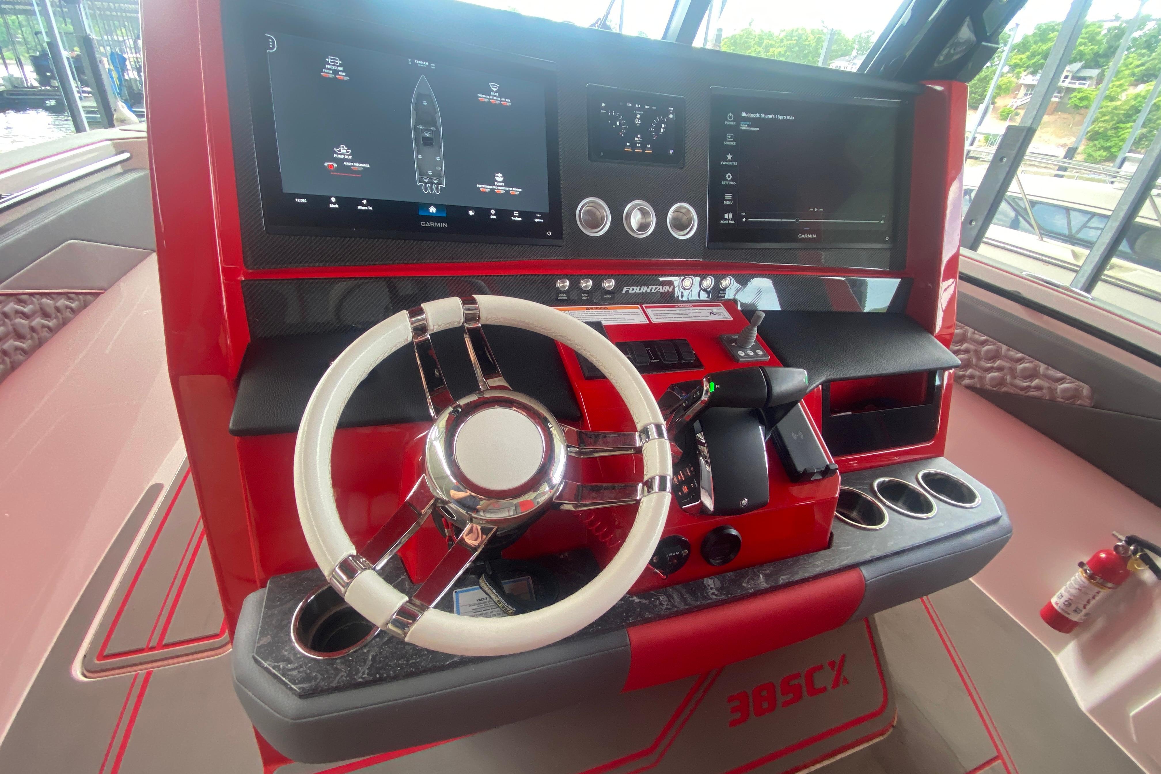 2025 Fountain 38 SCX boat dashboard with modern controls and dual display screens.