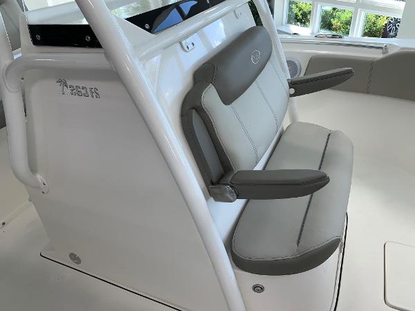 2024 Key West 263 FS boat seating area with cushioned seats and armrests.