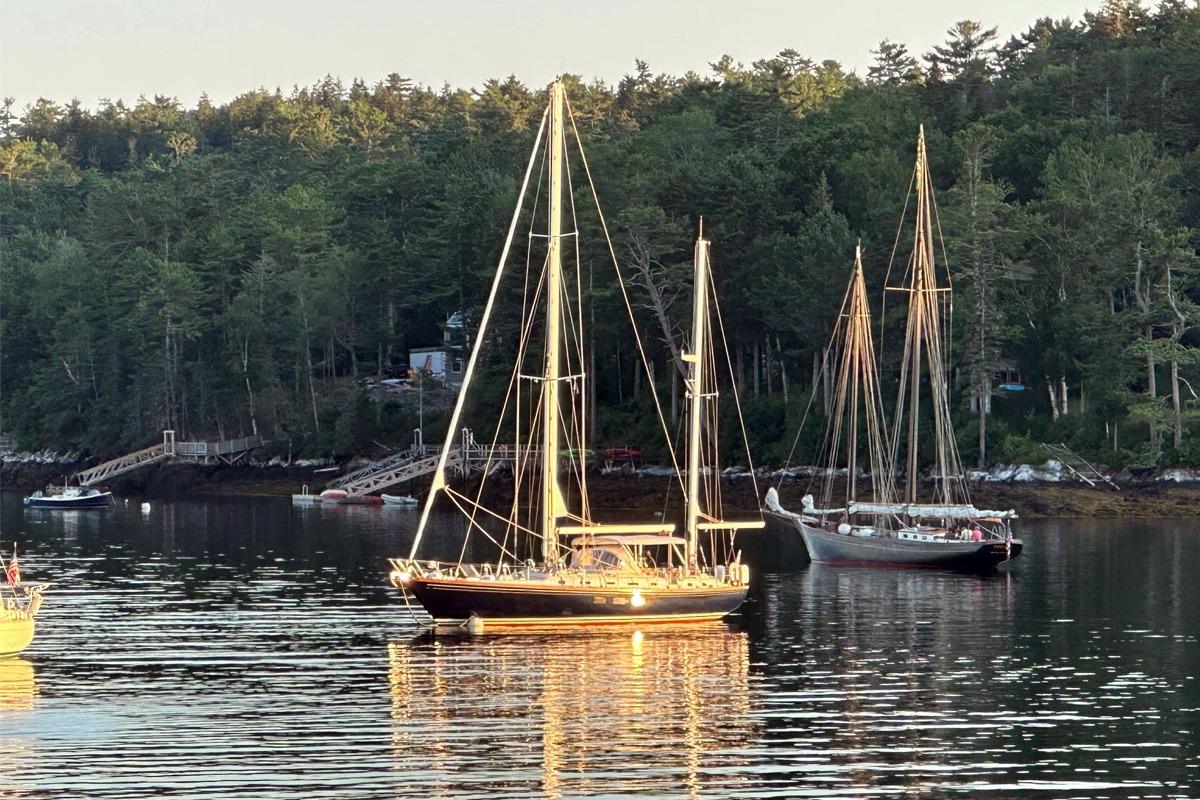 Sailboats anchored in a serene harbor, featuring a 1988 Little Harbor 53.