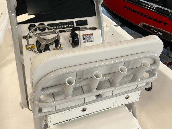 2024 Sea Fox 231 Bay boat console with steering wheel and rod holders.