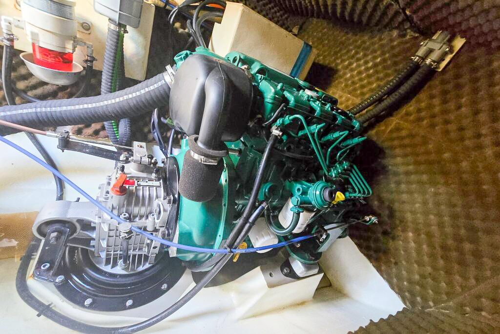 Engine compartment of a 2006 Dolphin 460, showcasing mechanical components and wiring.