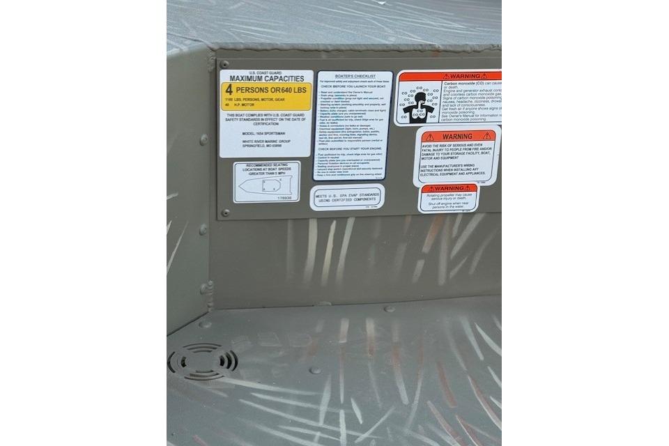 2025 Tracker Grizzly 1654 T Sportsman capacity and safety warning labels.