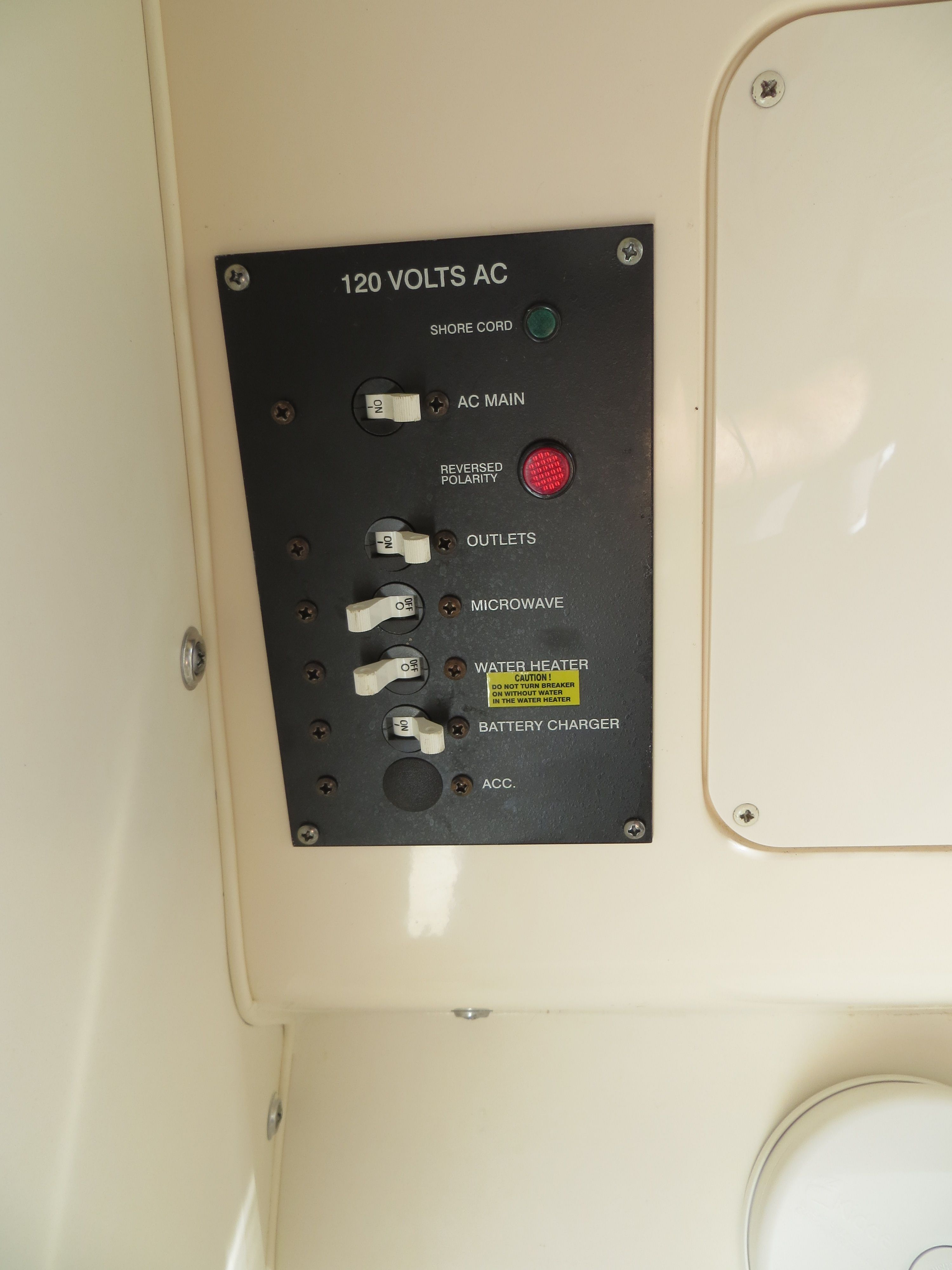 Control panel with toggle switches for power supply and appliances.