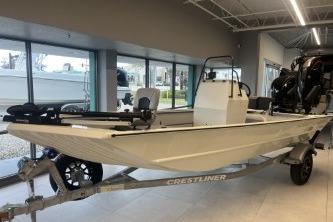 2026 Crestliner 1860 Retriever CC boat displayed indoors on a trailer.