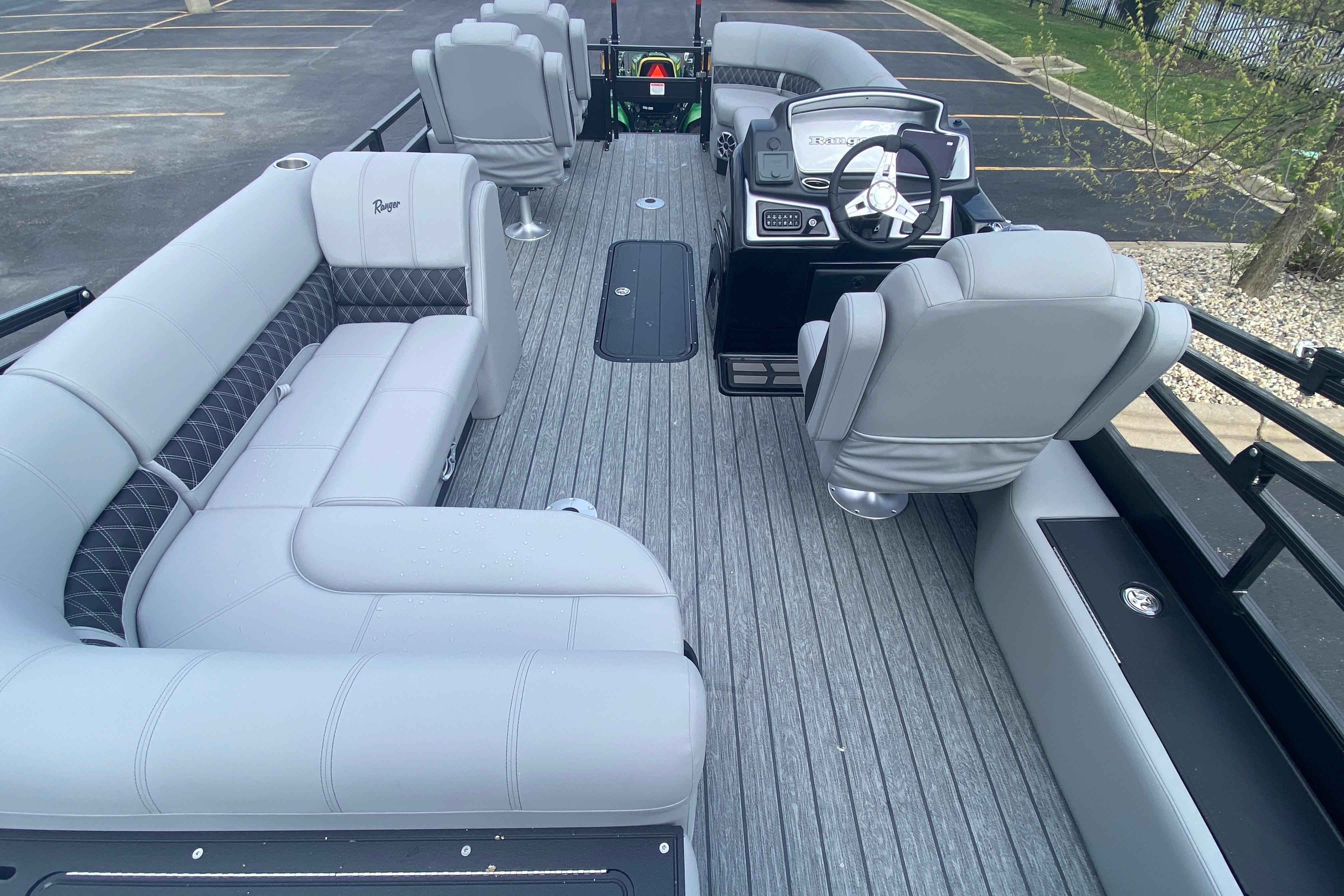 2026 Ranger 223FC boat interior with gray seating and modern steering console.