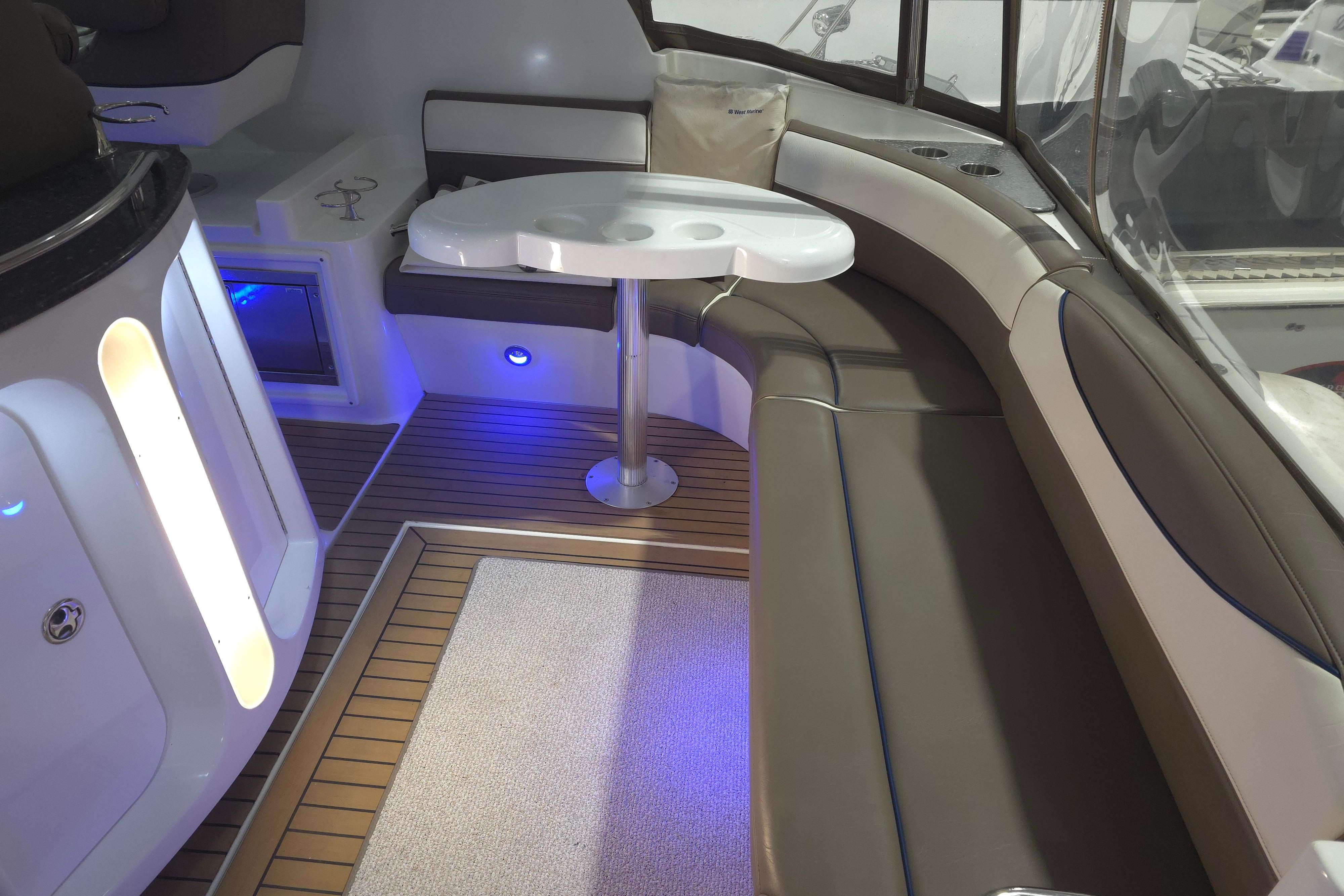 2008 Cruisers Yachts 390 Sports Coupe interior with seating and table, featuring modern design.