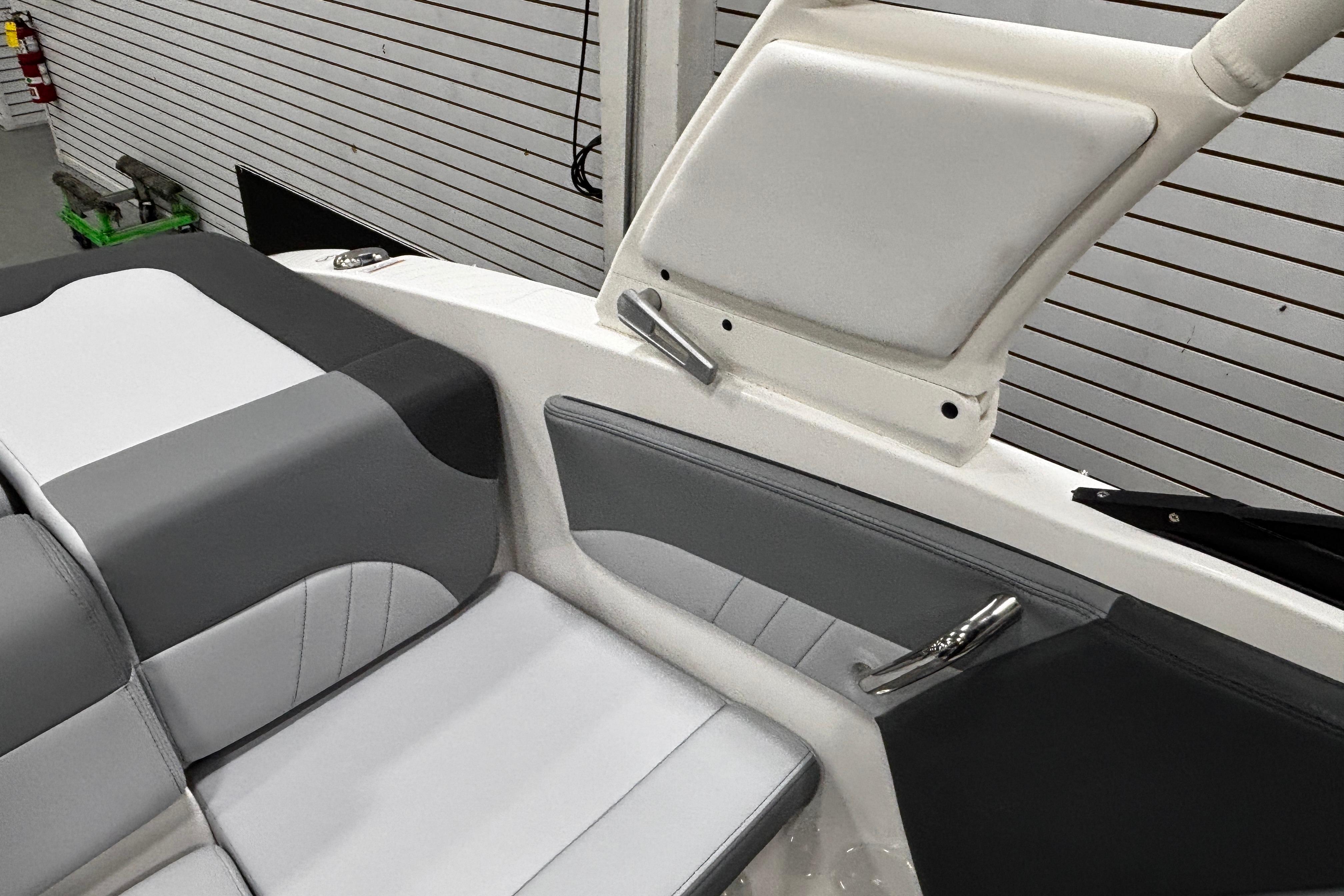Interior of 2026 Chaparral 21 SSi boat with gray and white seating.