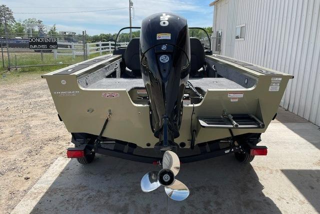 2026 Tracker Targa V-18 WT boat, rear view with motor, parked outdoors.