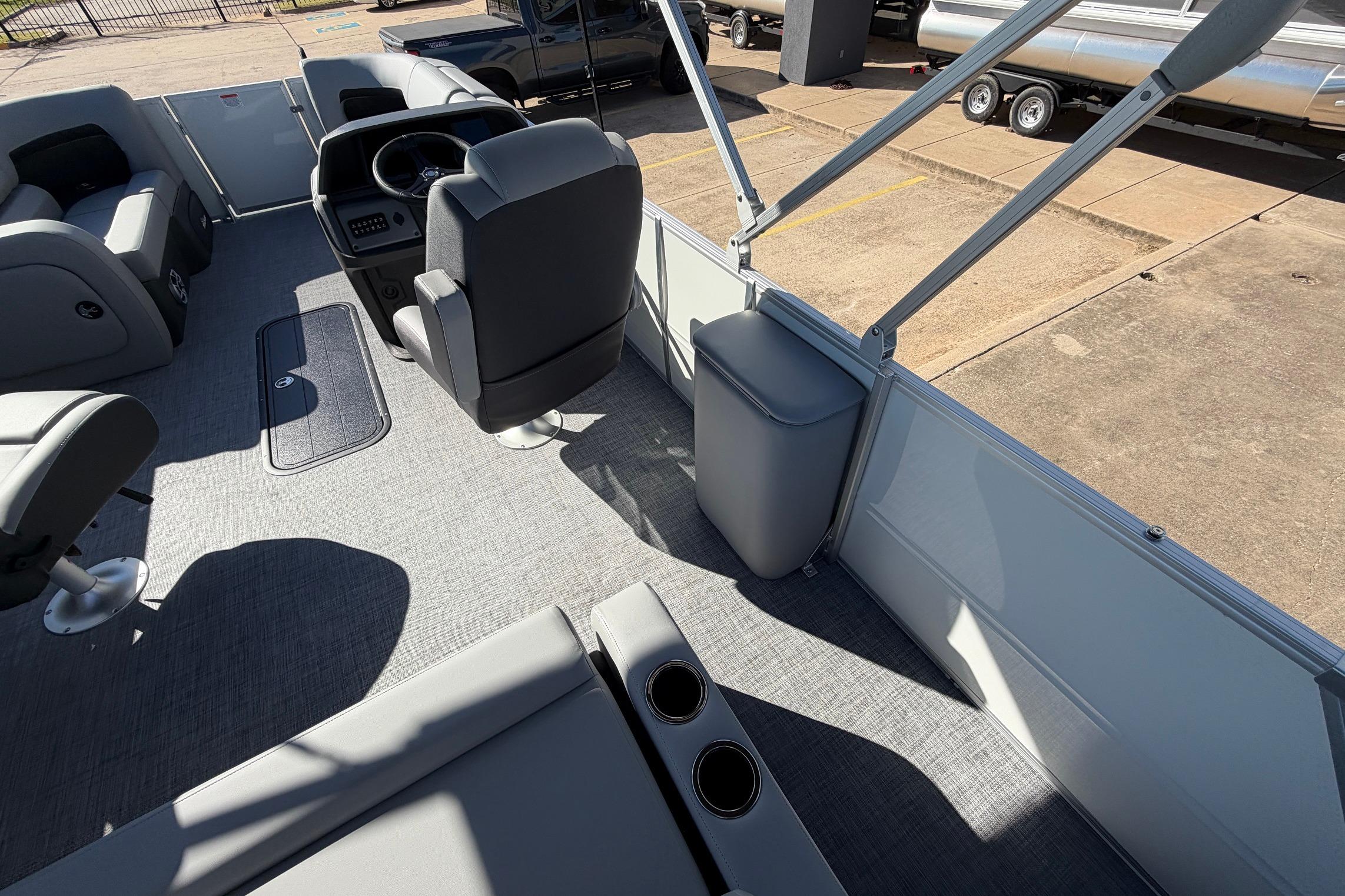 2026 Sun Tracker Party Barge 22 RF XP3 interior with seating and steering console.