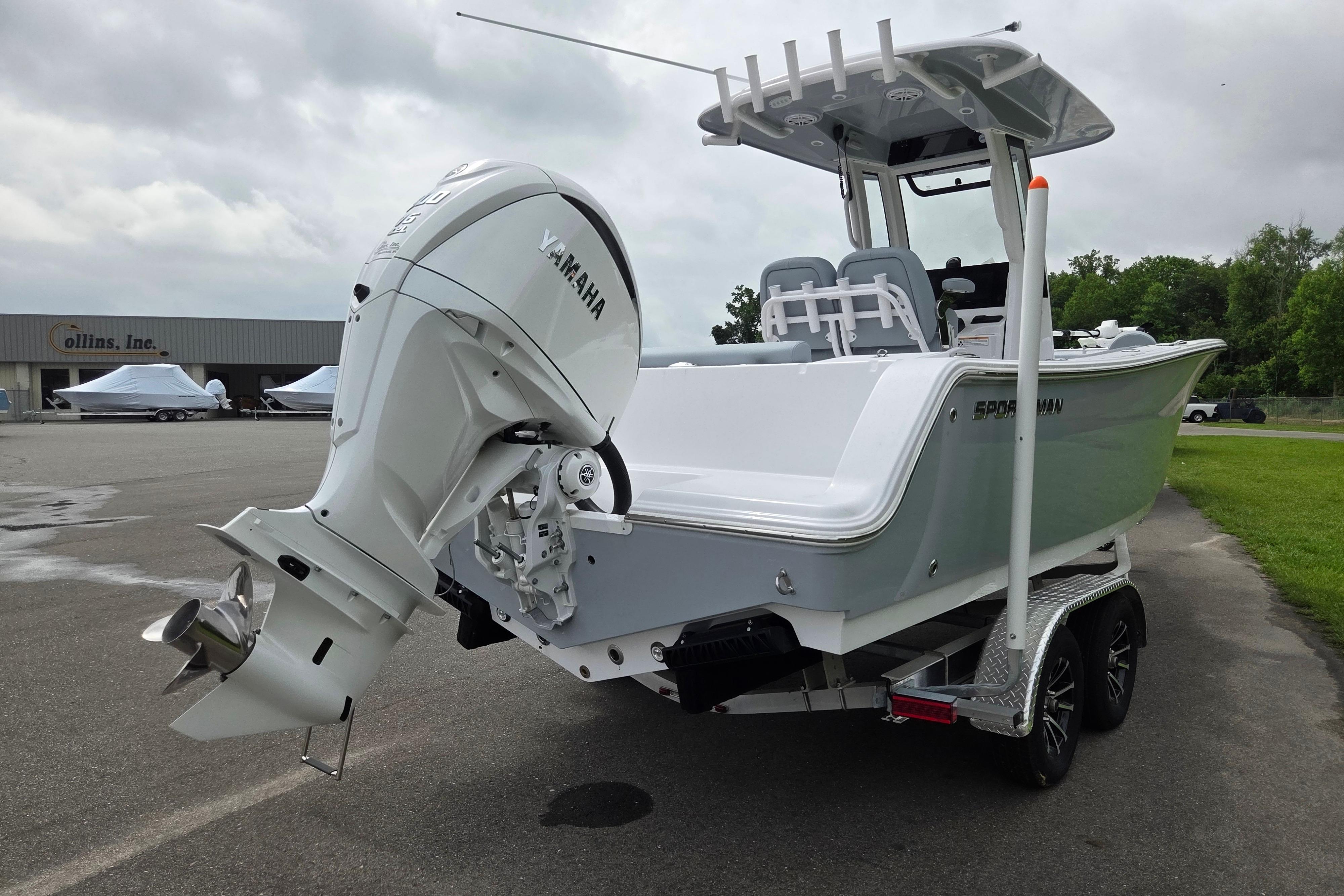 2026 Sportsman Open 232 Center Console boat with Yamaha engine on trailer.