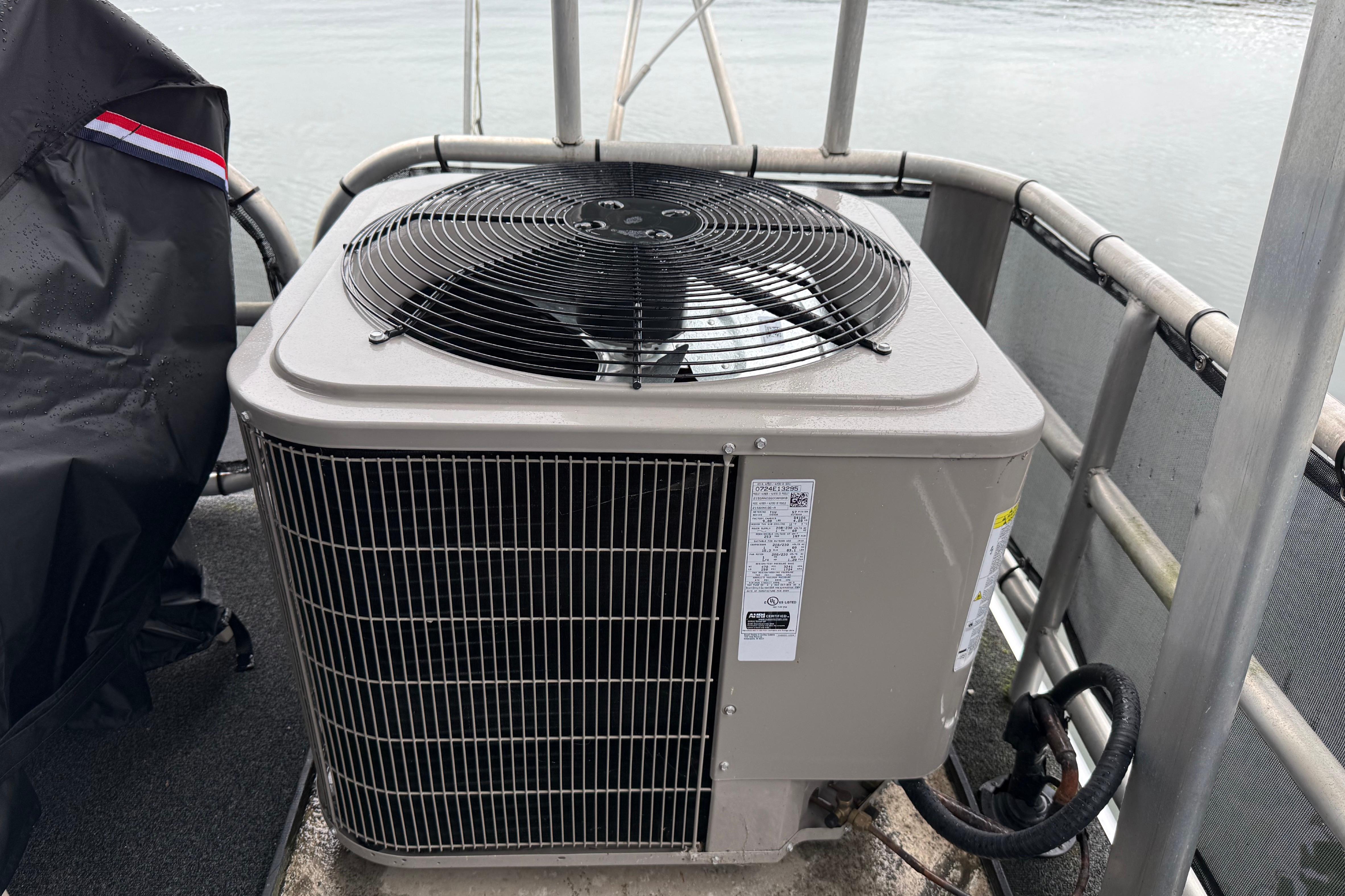 Outdoor air conditioning unit on a boat deck, Sharpe 80 X 18, 2001 model.