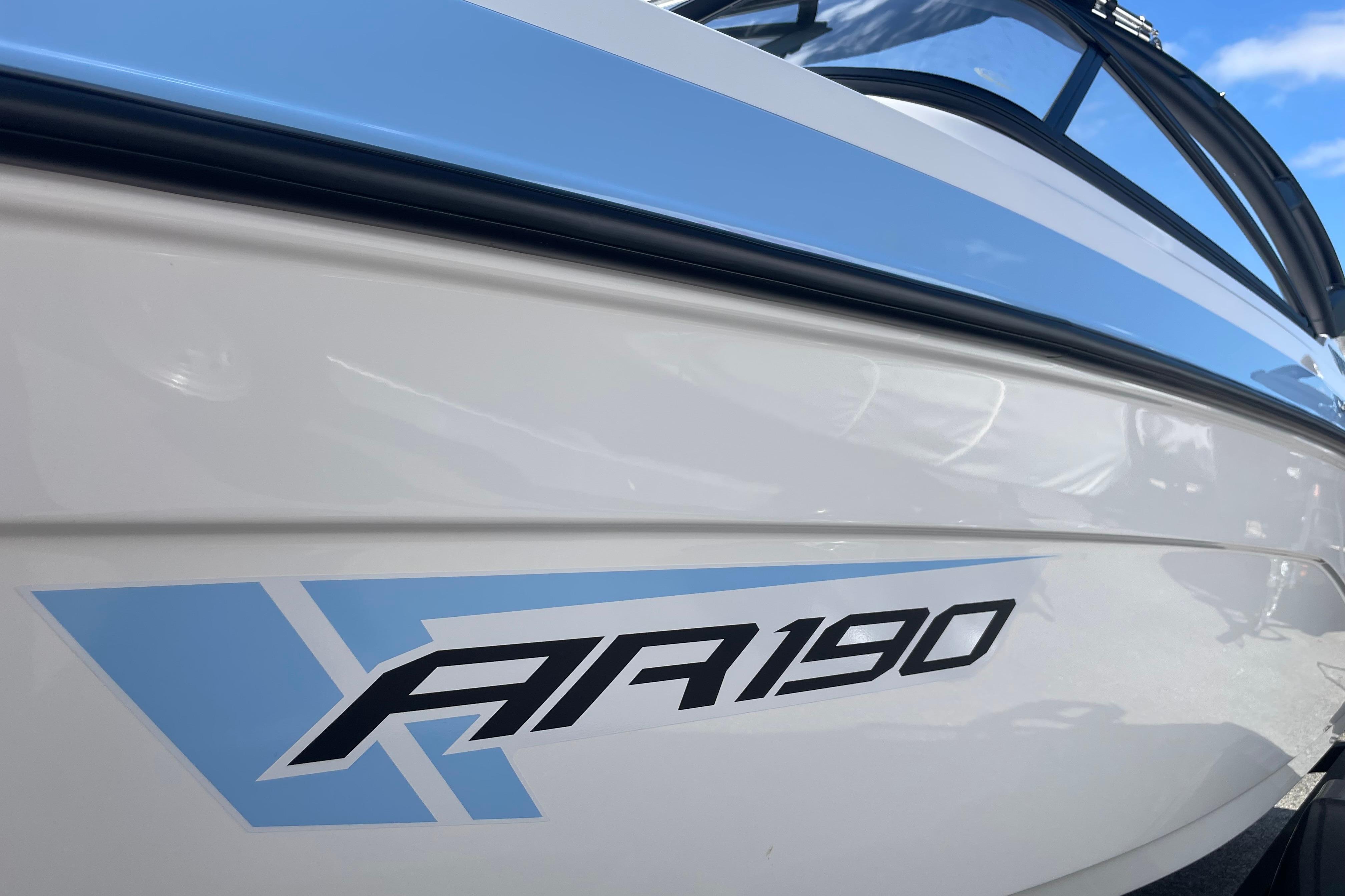 2026 Yamaha Boats AR190, sleek white and blue design, close-up view.
