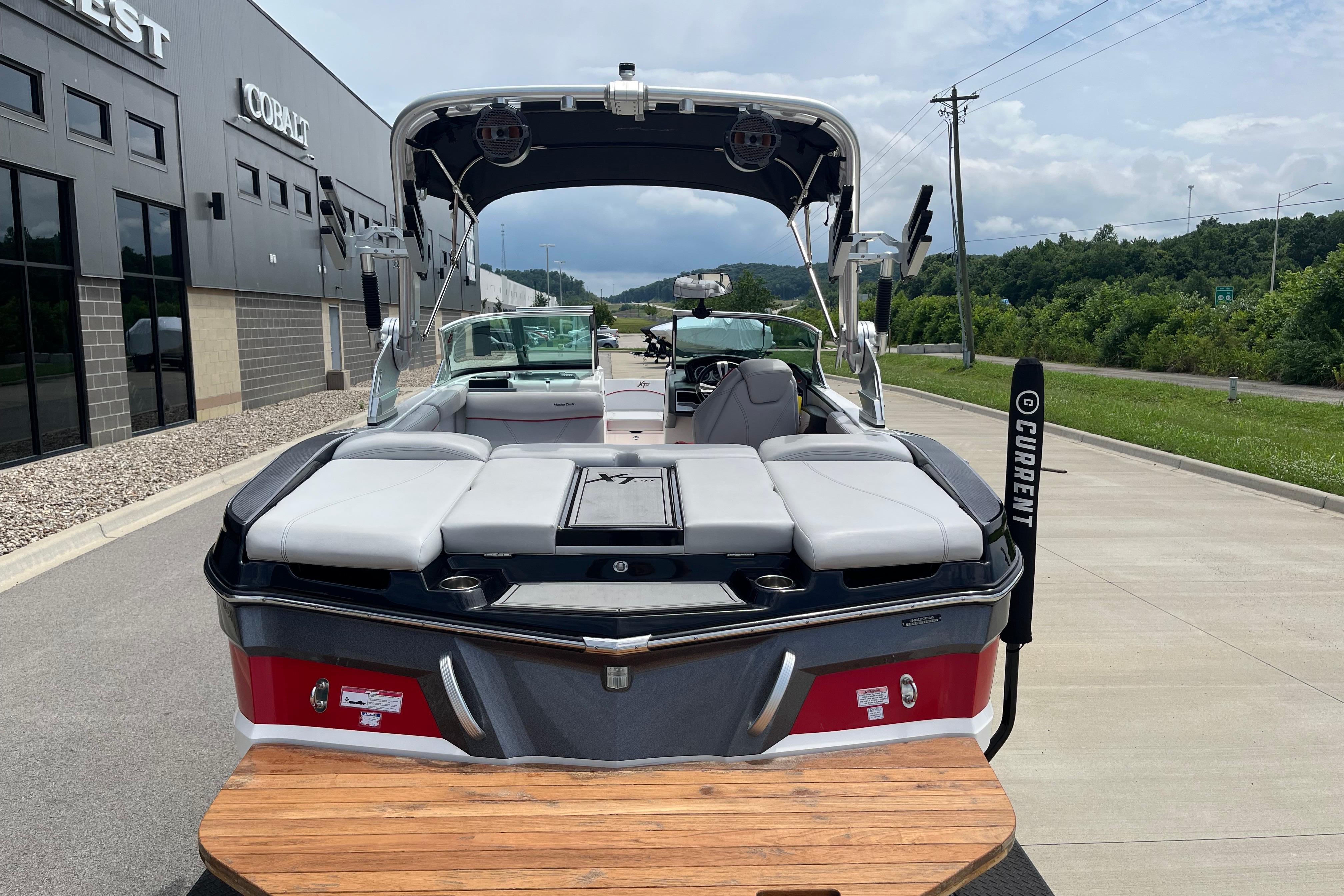 2019 MasterCraft XT20 boat with sleek design, parked outdoors near dealership.