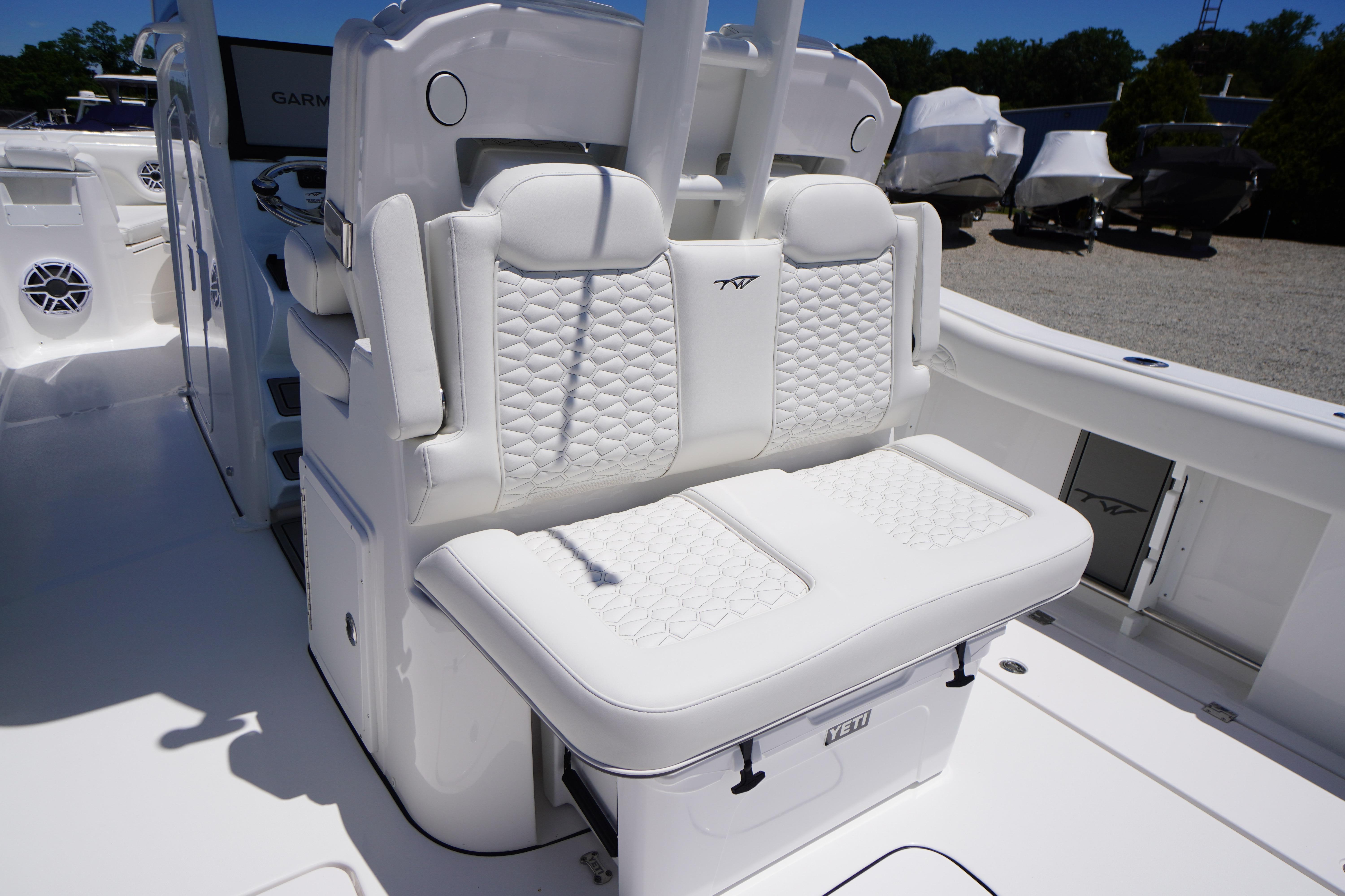 2026 Tidewater 302 CC Adventure boat with luxurious white seating and modern design.
