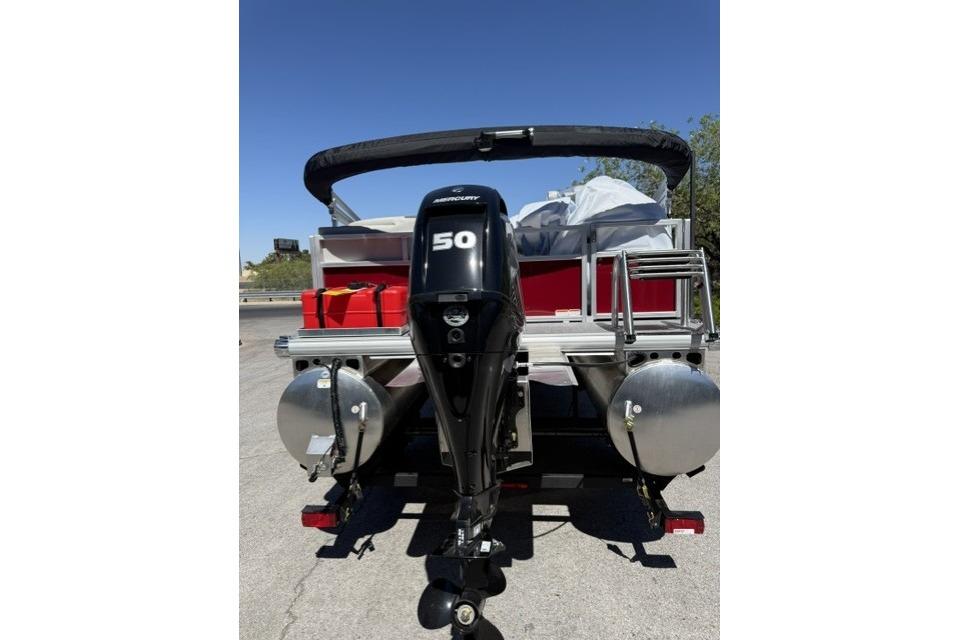 2026 Sun Tracker Bass Buggy 16 XL Select pontoon boat with Mercury 50 HP outboard motor.
