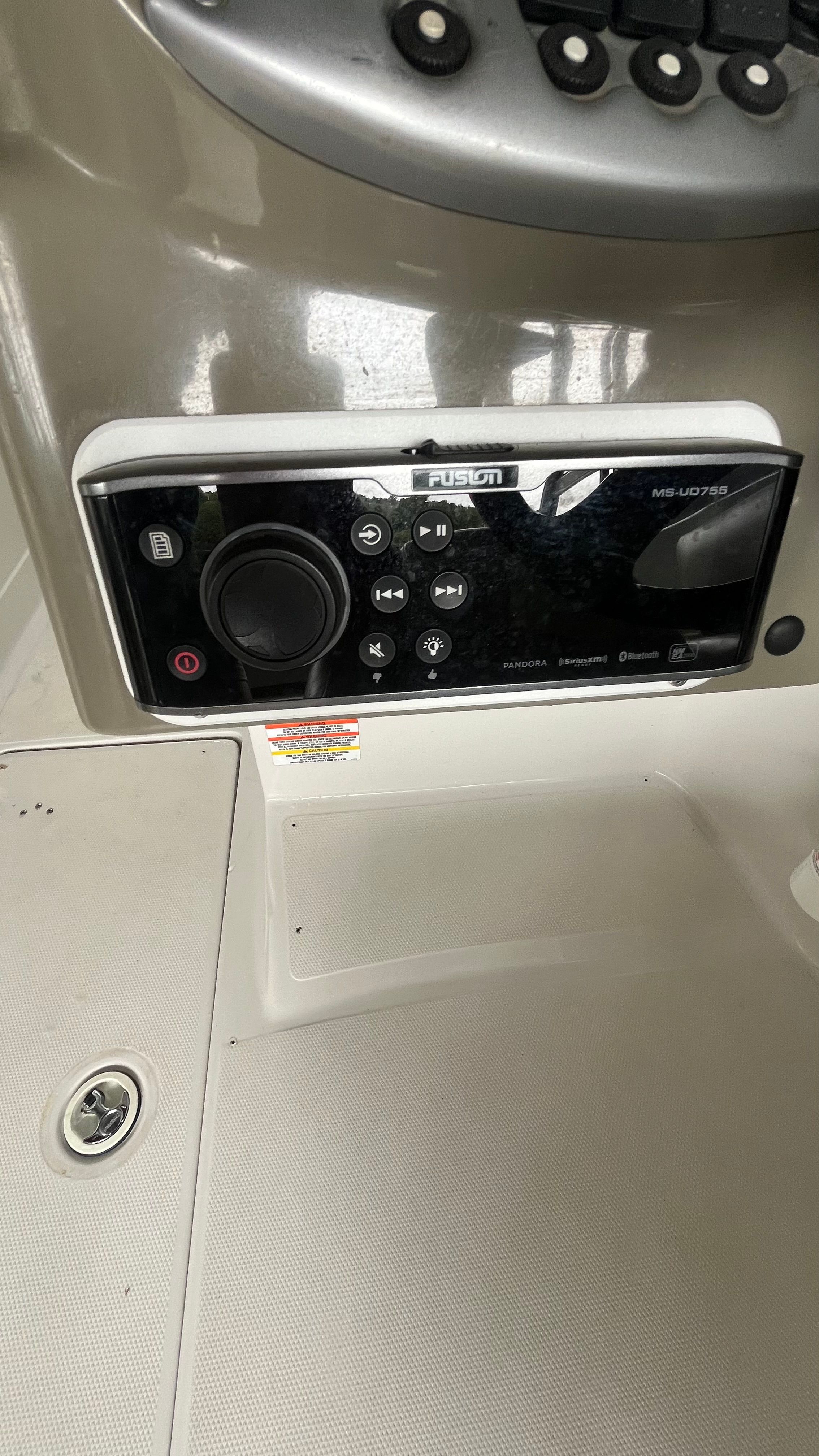 Close-up of a Fusion MS-UD755 marine stereo system on a Crownline 252EX boat.