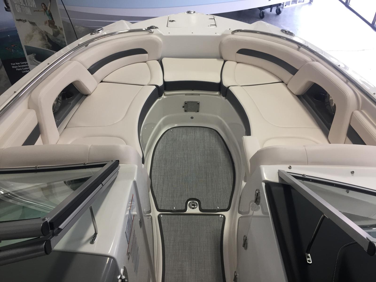 Interior view of 2019 Chaparral 264 Sunesta with beige seating.