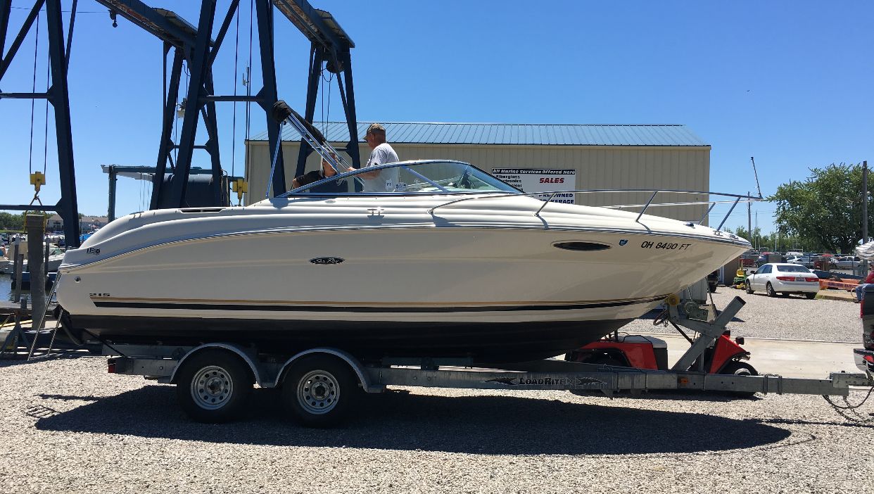 2006 Sea Ray 215 Weekender on a trailer at the marina.